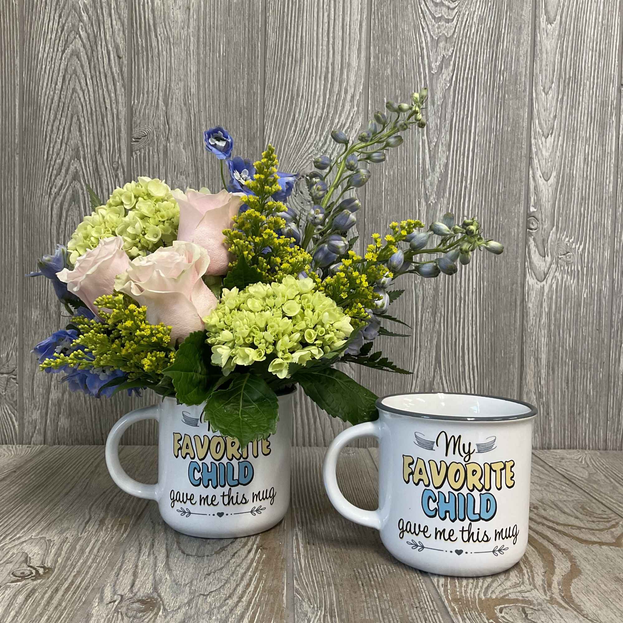 A soft floral arrangement in a funny keepsake mug - a perfect, photo 2 of 4