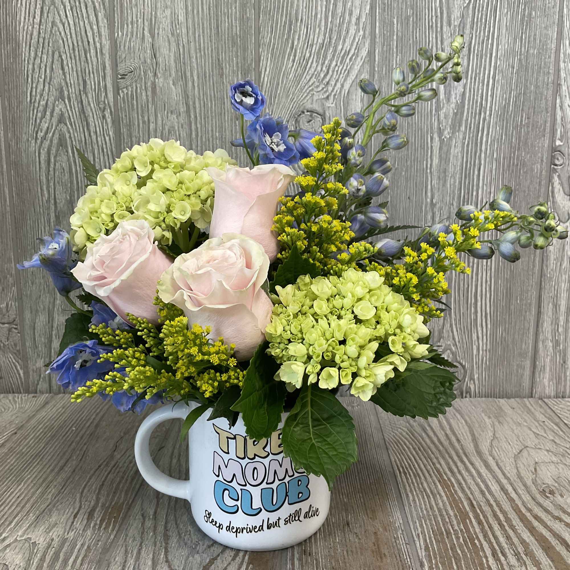 A soft floral arrangement in a relatable keepsake mug. Makes a great, photo 2 of 4