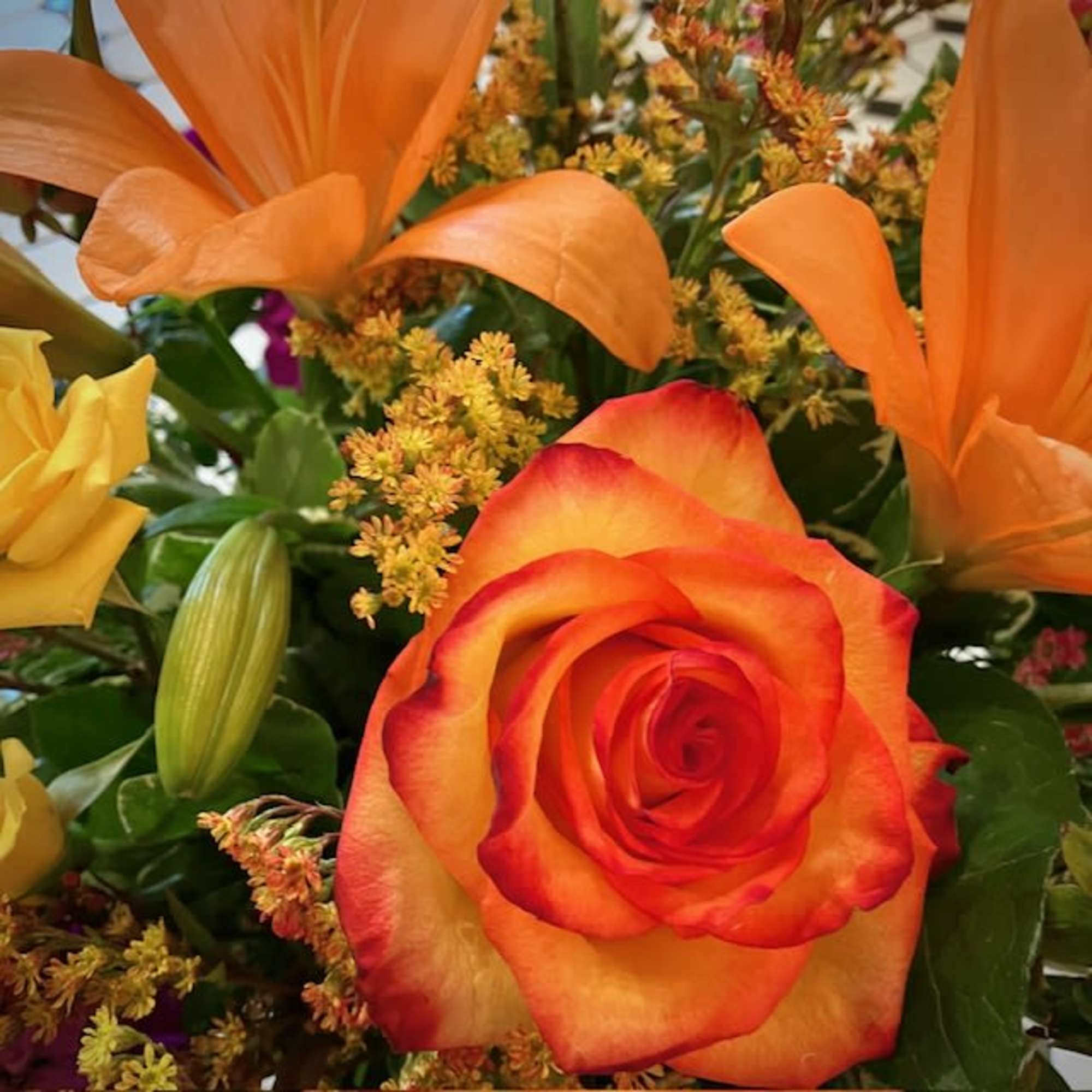 Orange and yellow rose bouquet with orange lilies