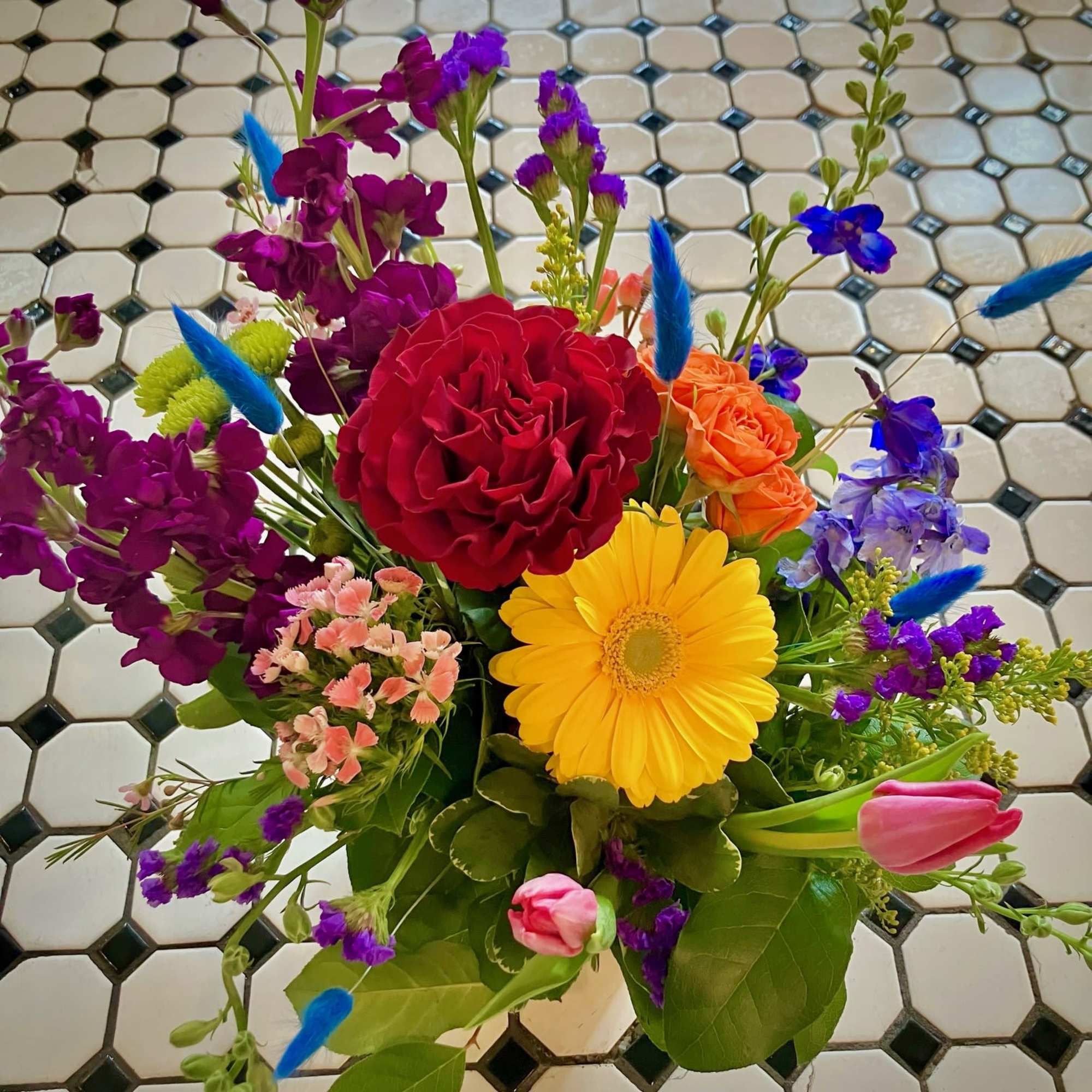 Colorful mixed bouquet with roses, gerbera daisy, and tulips