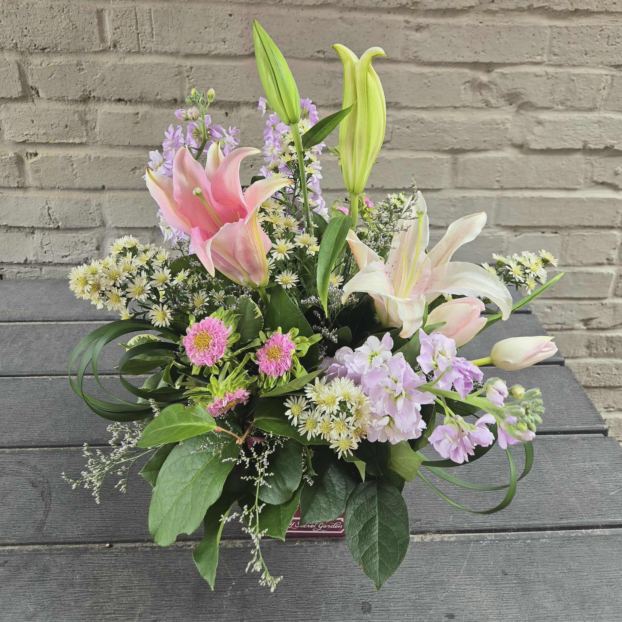 Reach into the luscious spring spirit with the Blooming Hope arrangement. Featuring