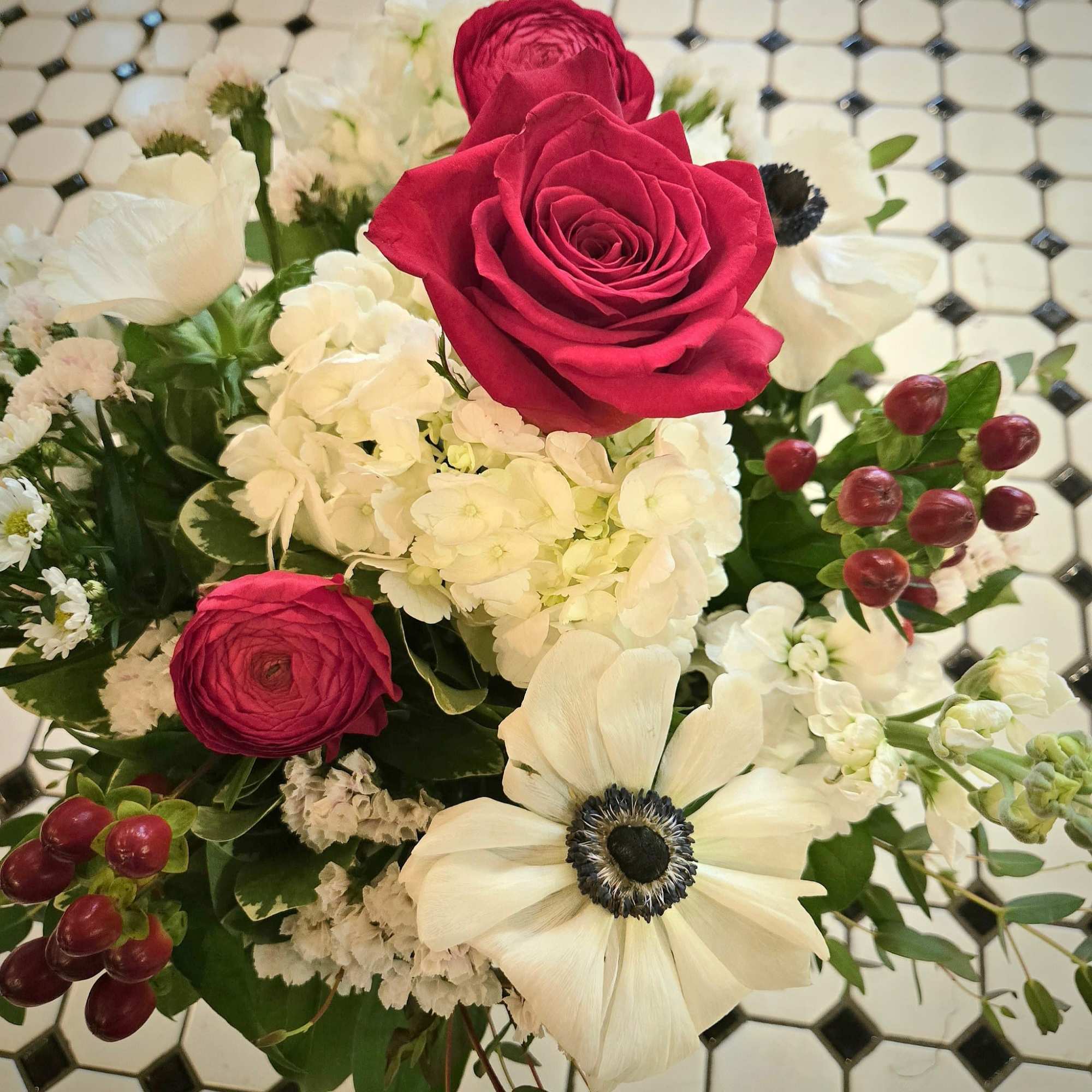 The Summer Picnic pairs vivid red roses and ranunculus with crisp white, photo 3 of 3