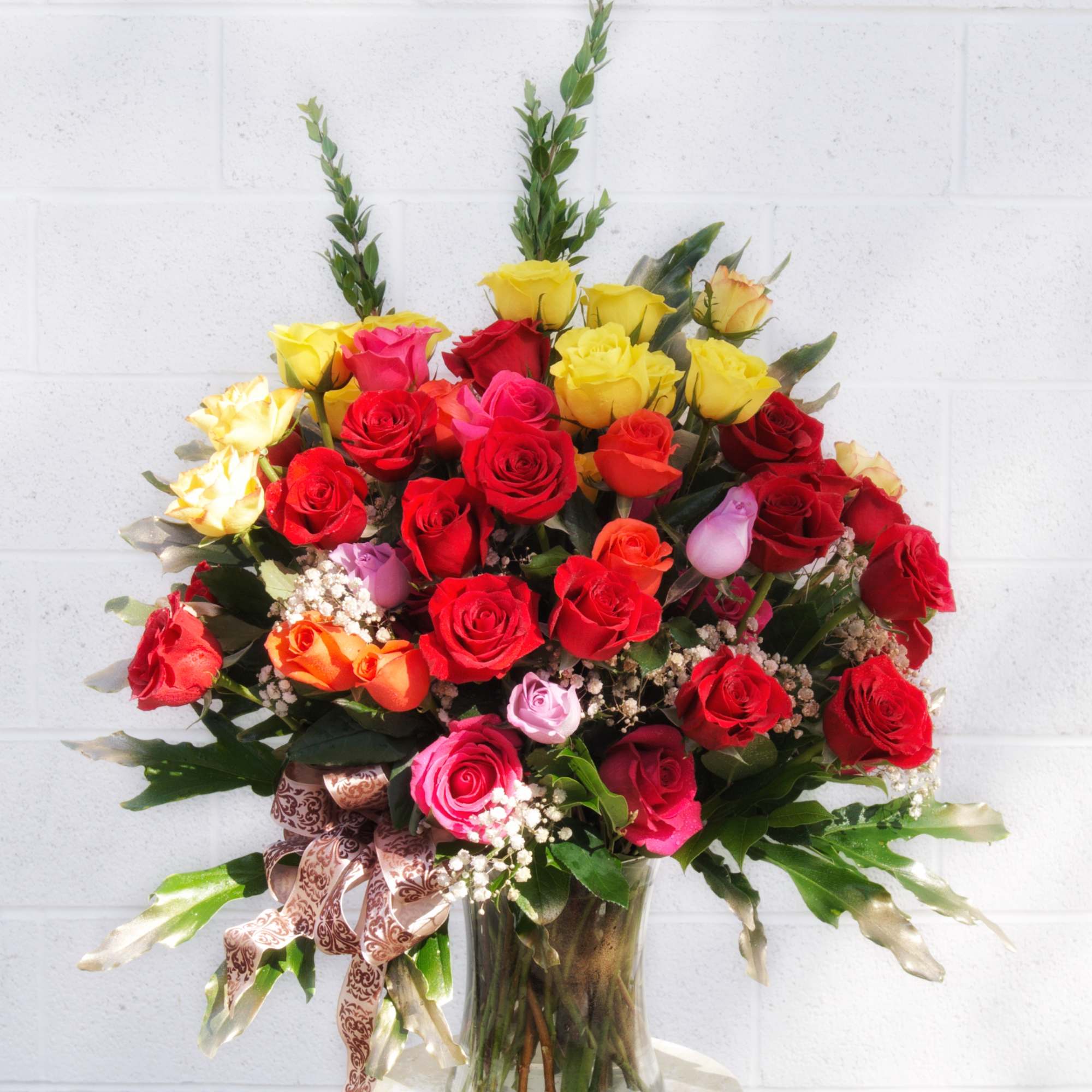 Assorted color Ecuadorian roses with accents in a tall glass vase
STANDARD: FIRST