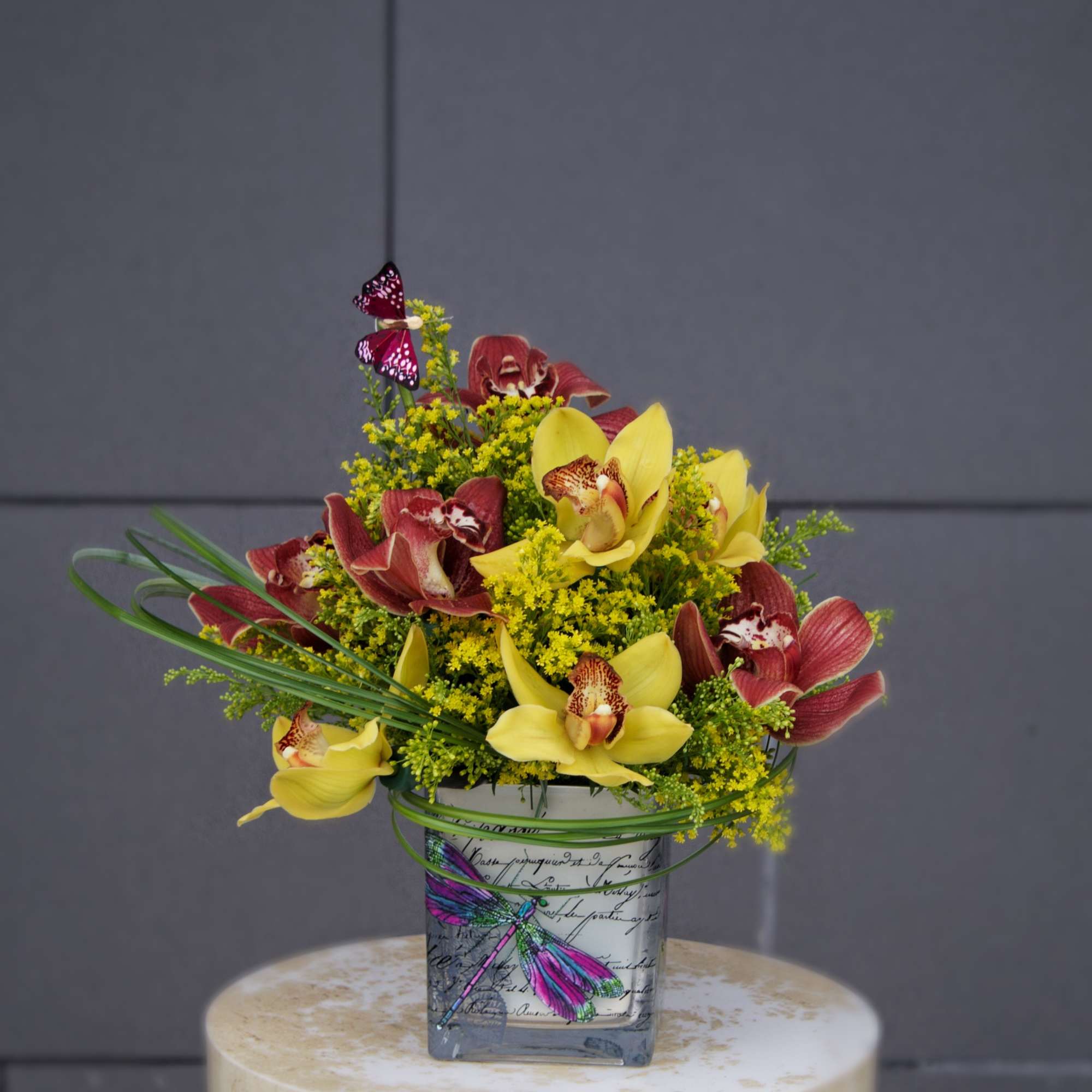A pretty design including cymbidium orchids and accents in a nice container.
STANDARD:, photo 2 of 3
