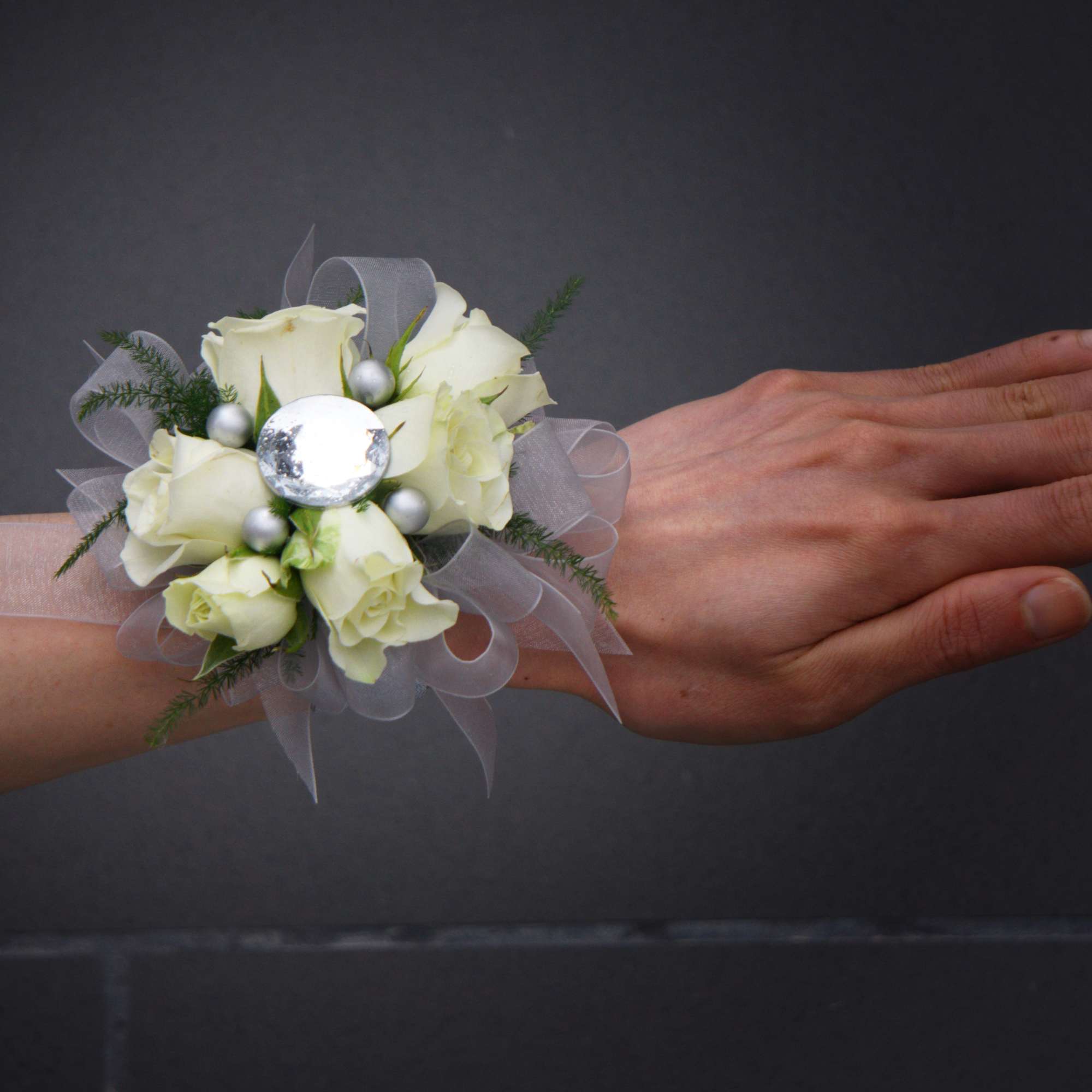 White rose wrist corsage with silver ribbon and beads