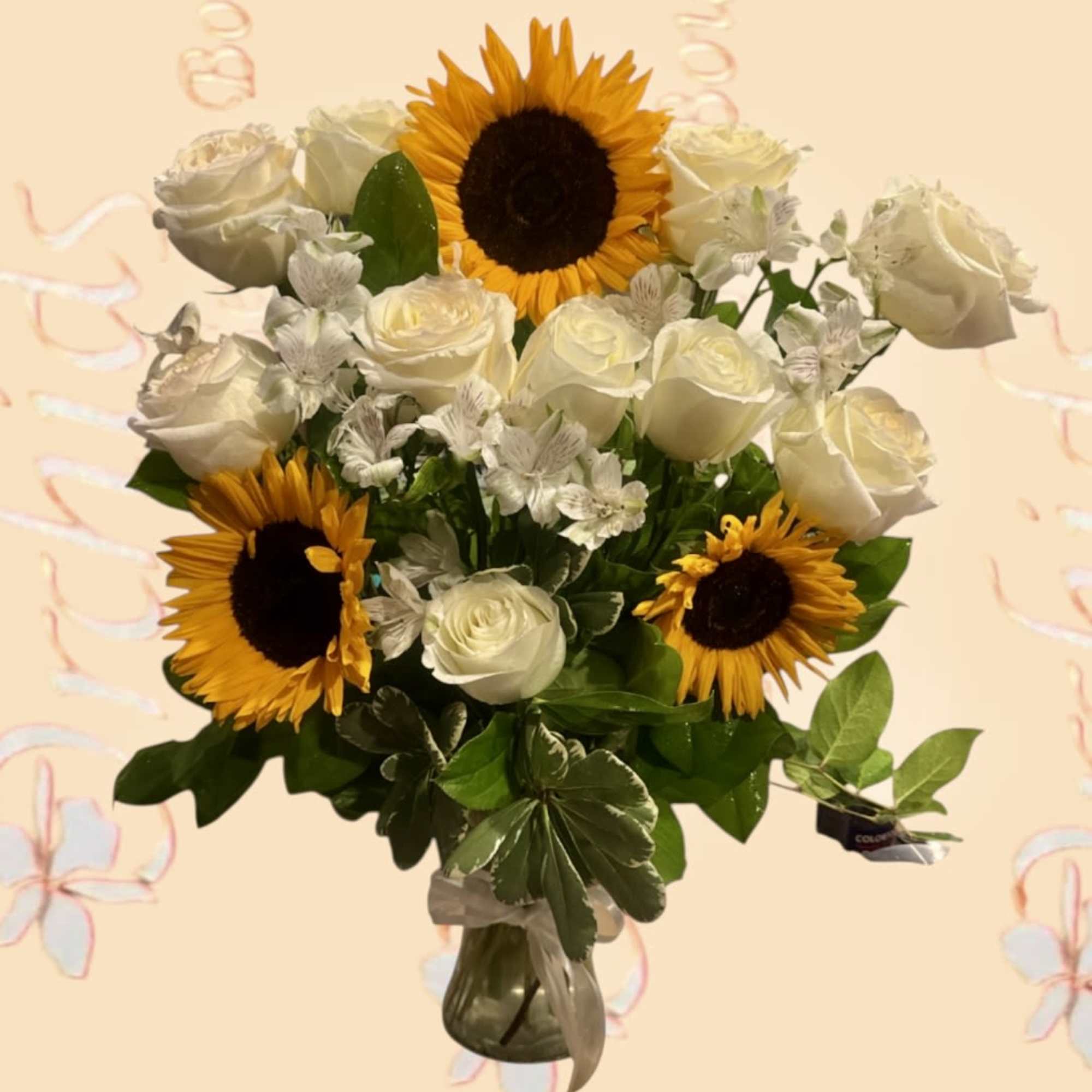Bouquet of white roses and sunflowers in a glass vase