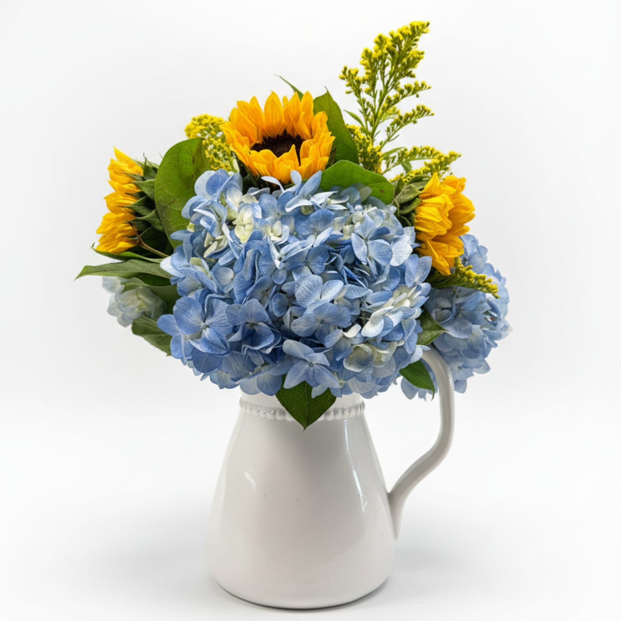 Blue hydrangeas form a lush, rounded mound punctuated by tall, sunny sunflowers-an