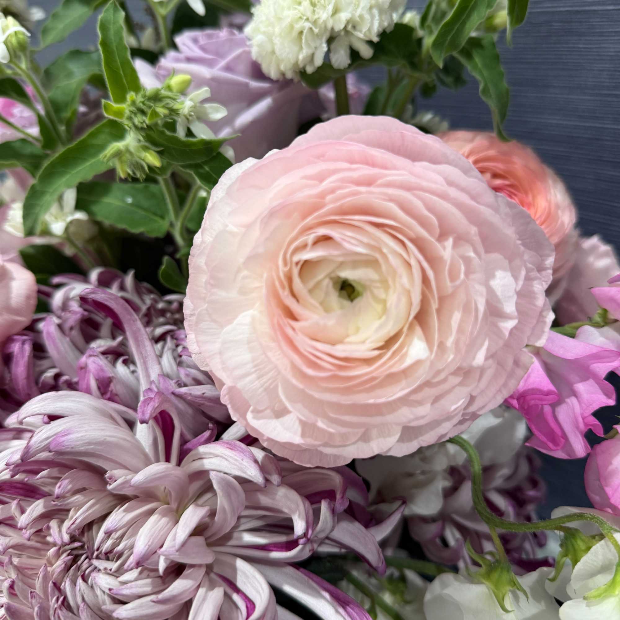 A soft, springlike blend of pinks, purples, whites, and fresh greens makes, photo 2 of 4