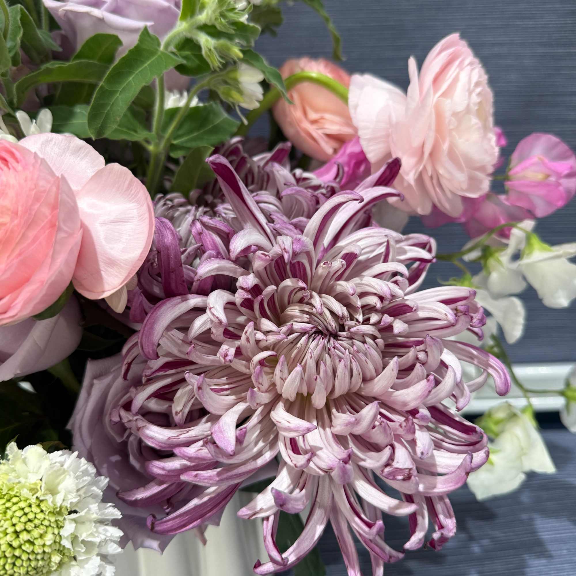 A soft, springlike blend of pinks, purples, whites, and fresh greens makes, photo 3 of 4