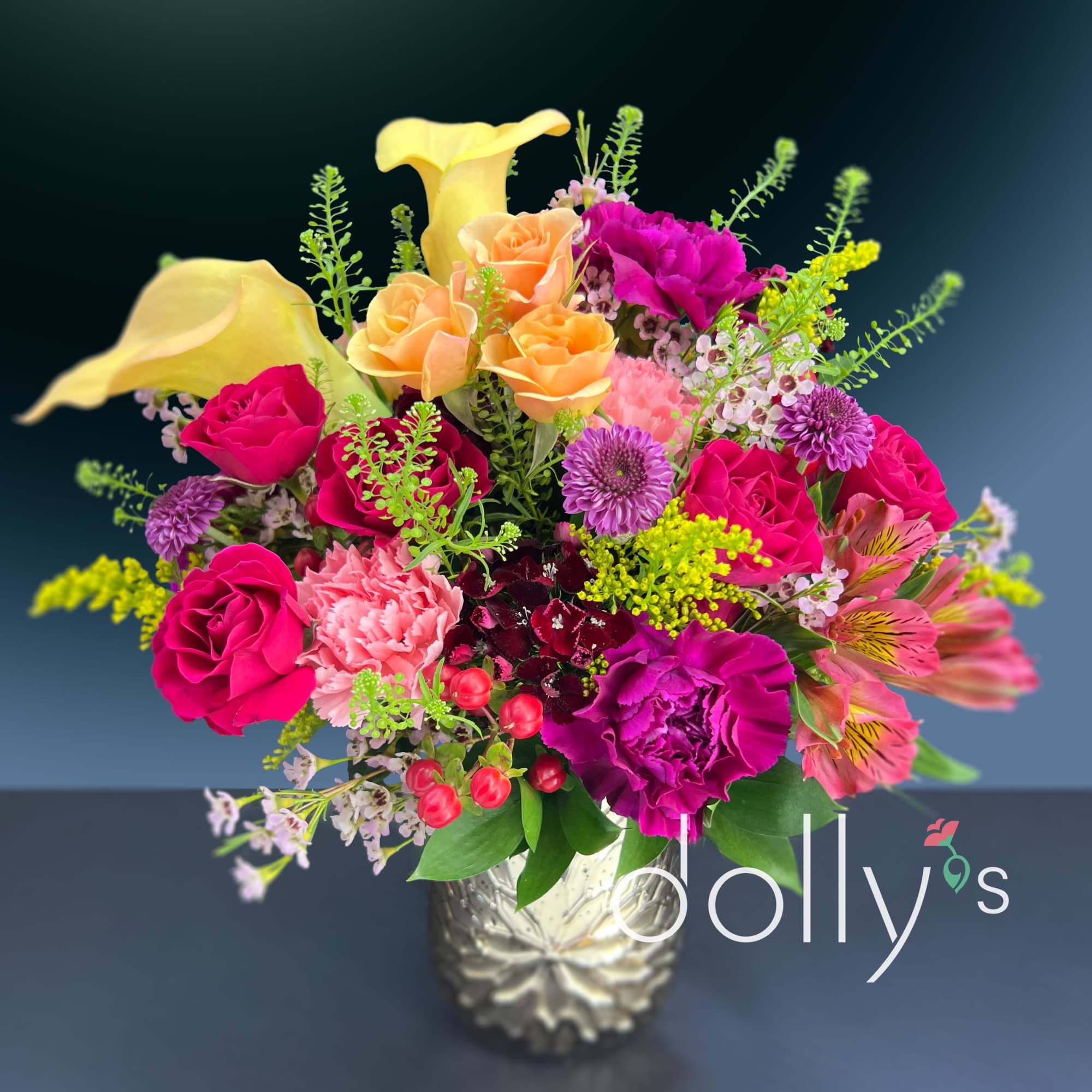 Vivid yellow calla lilies arch above a lush mix of roses and, photo 2 of 3