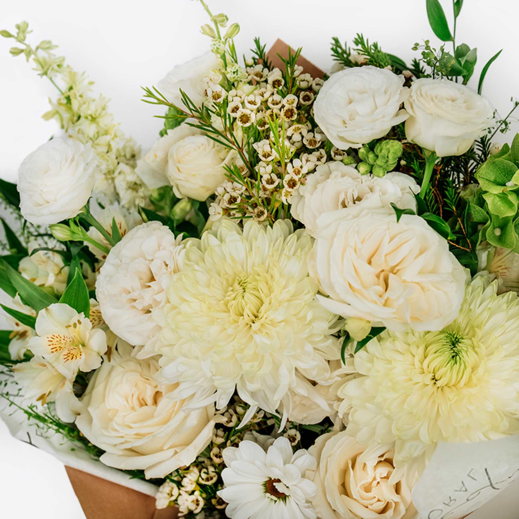 Bouquet of white roses and pale chrysanthemums with small filler flowers