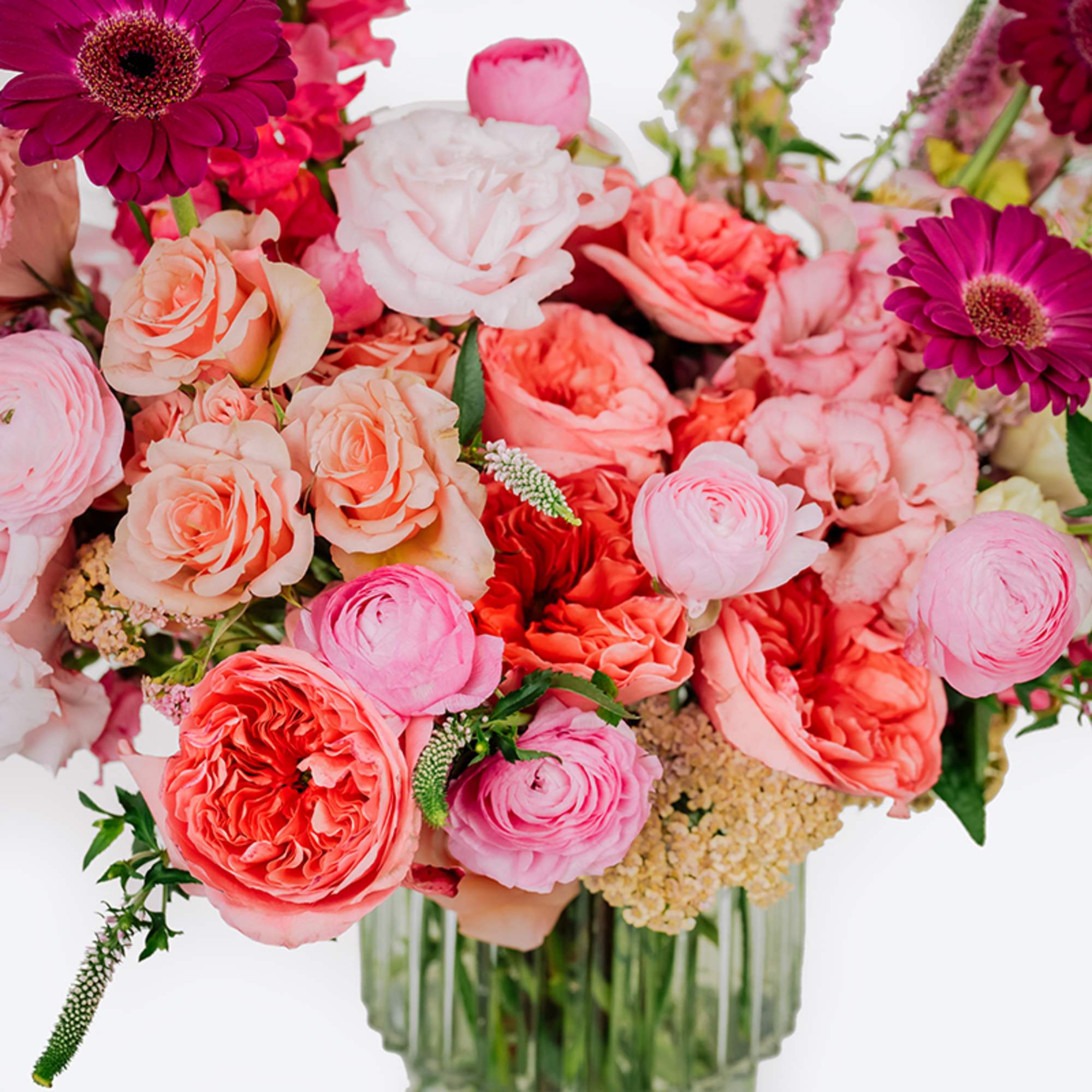 Pink and coral mixed bouquet in a clear glass vase, photo 4 of 4