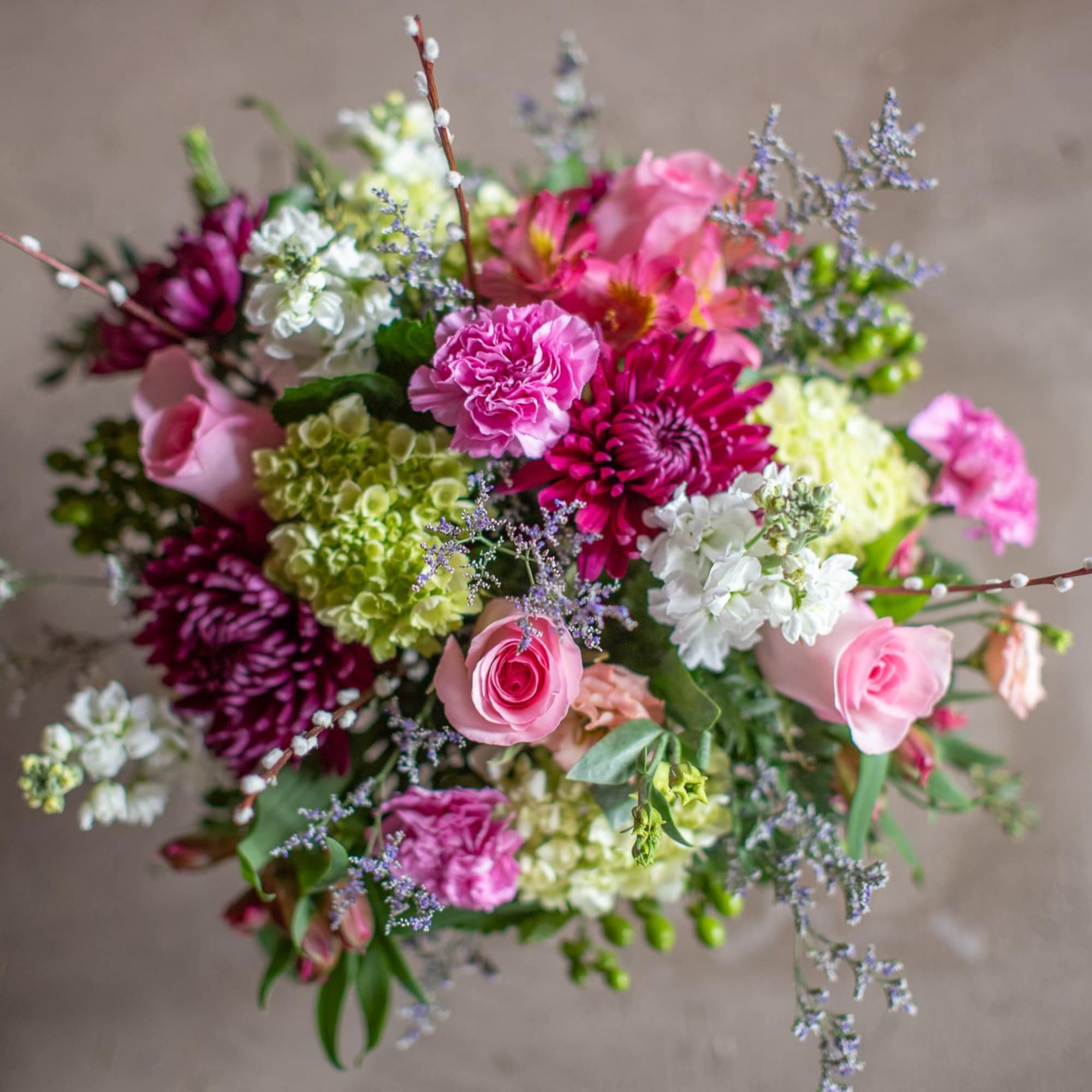 Mixed bouquet of pink, white, and purple flowers