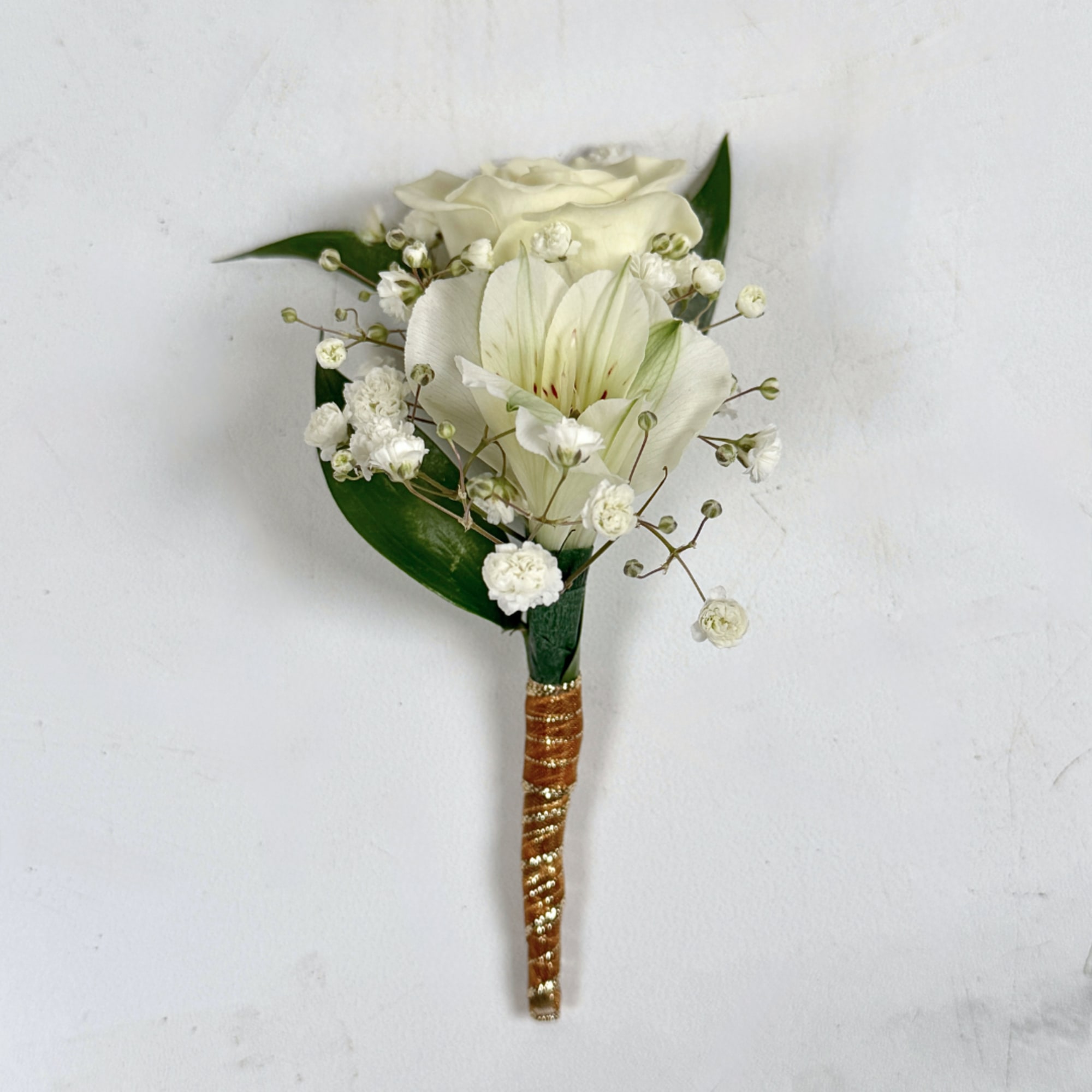 Our Elegant Ivory Boutonniere puts a subtle, but exciting spin on the