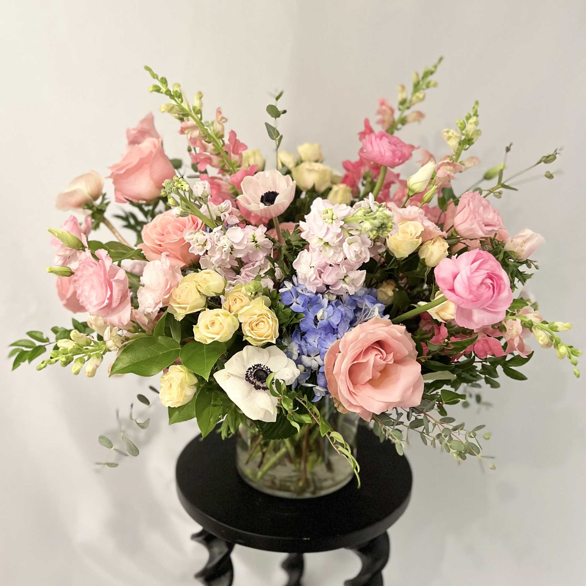 Mixed pastel bouquet in a glass vase