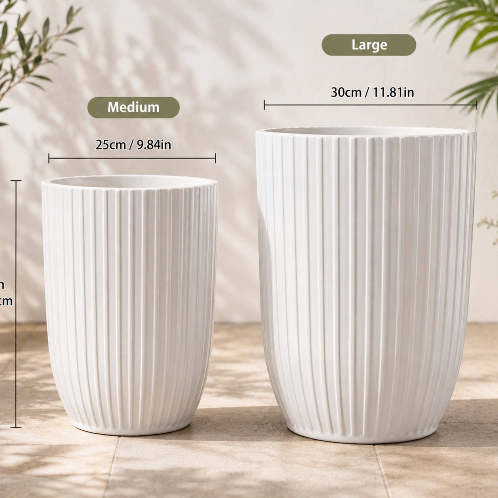 Two white ribbed ceramic planters in different sizes