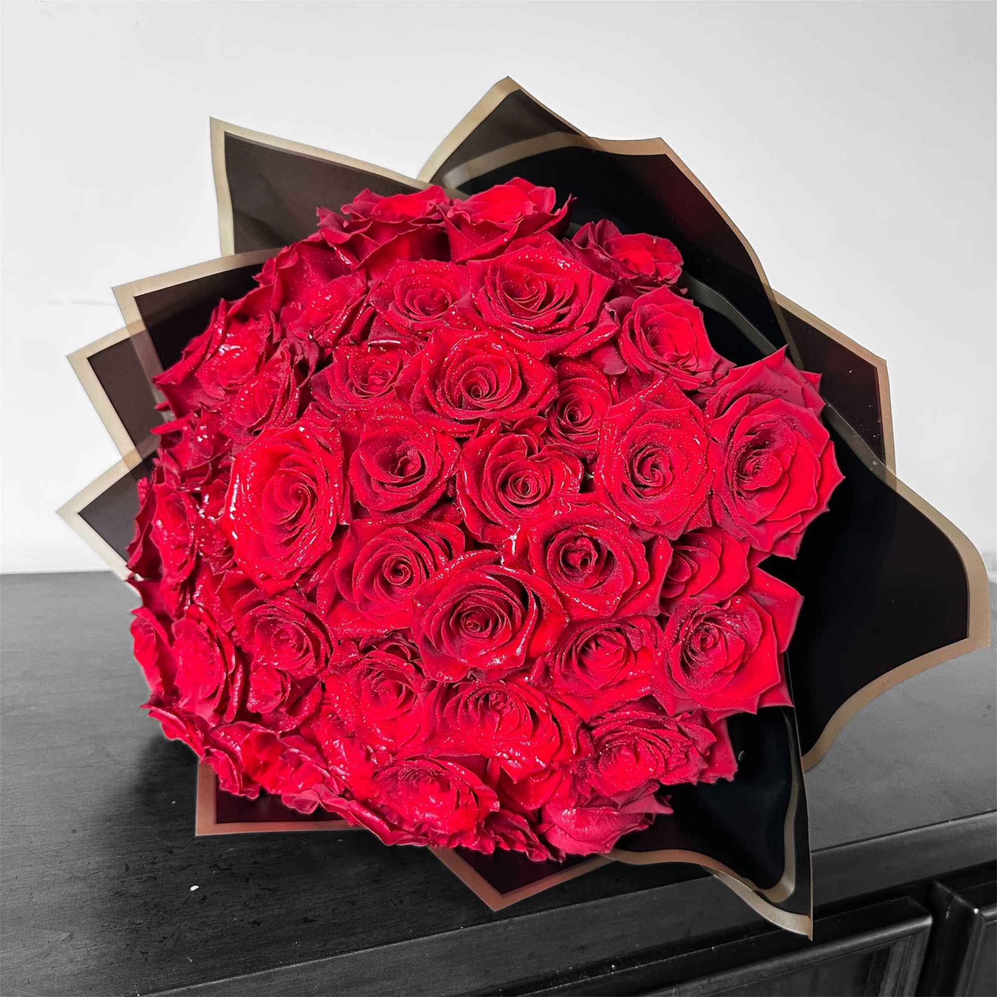 A dome of premium red roses arranged in a compact, luxurious cluster, photo 3 of 4