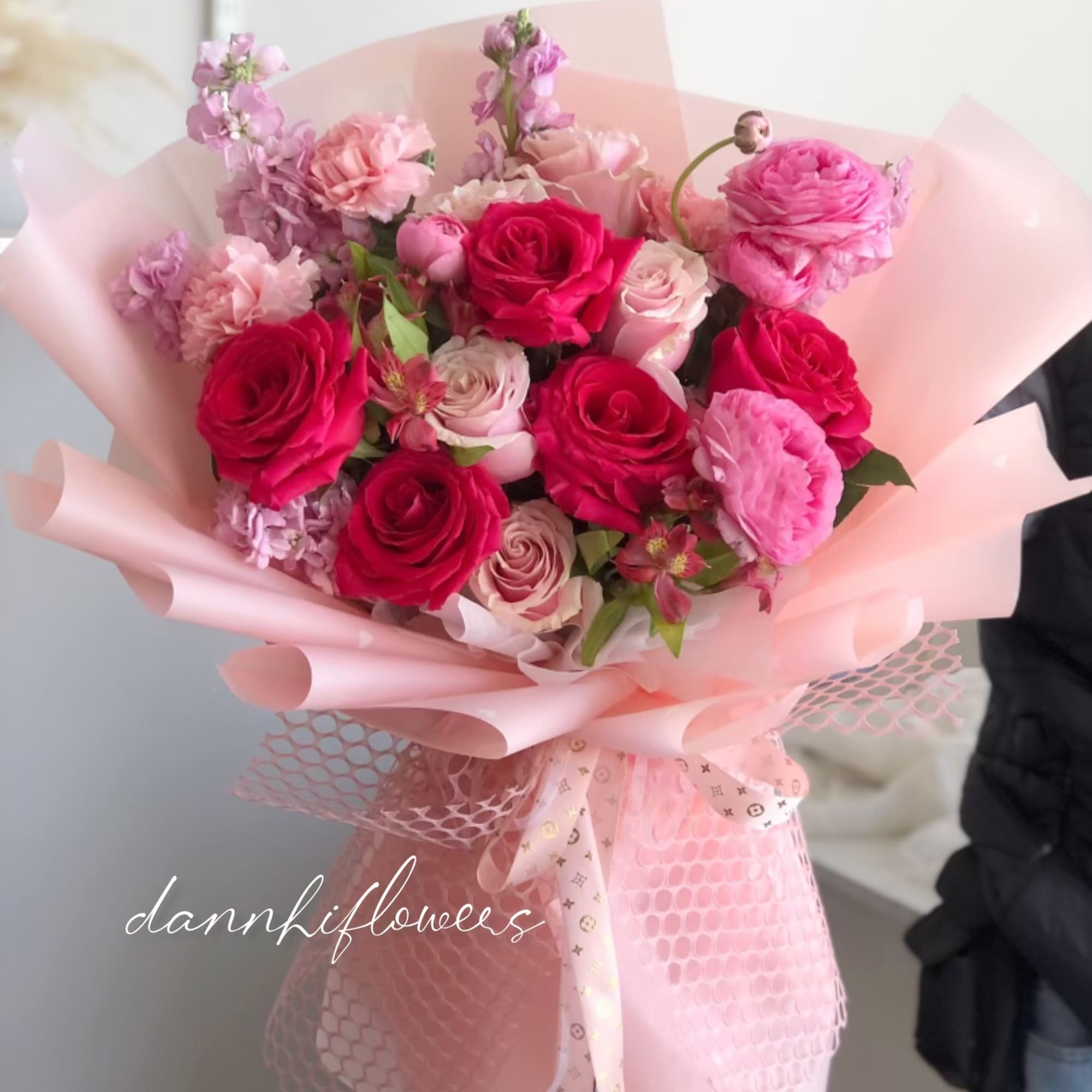 The Vivid Romance Bouquet is a captivating ensemble of radiant hot pink