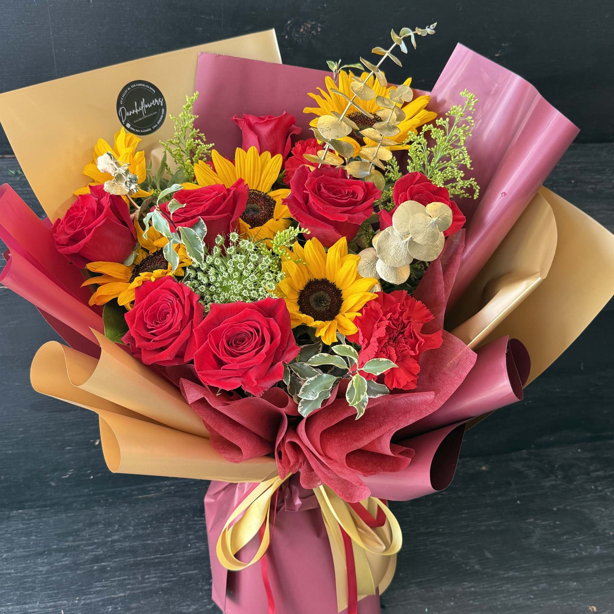 A bold graduation bouquet inspired by cardinal red and gold &mdash; featuring