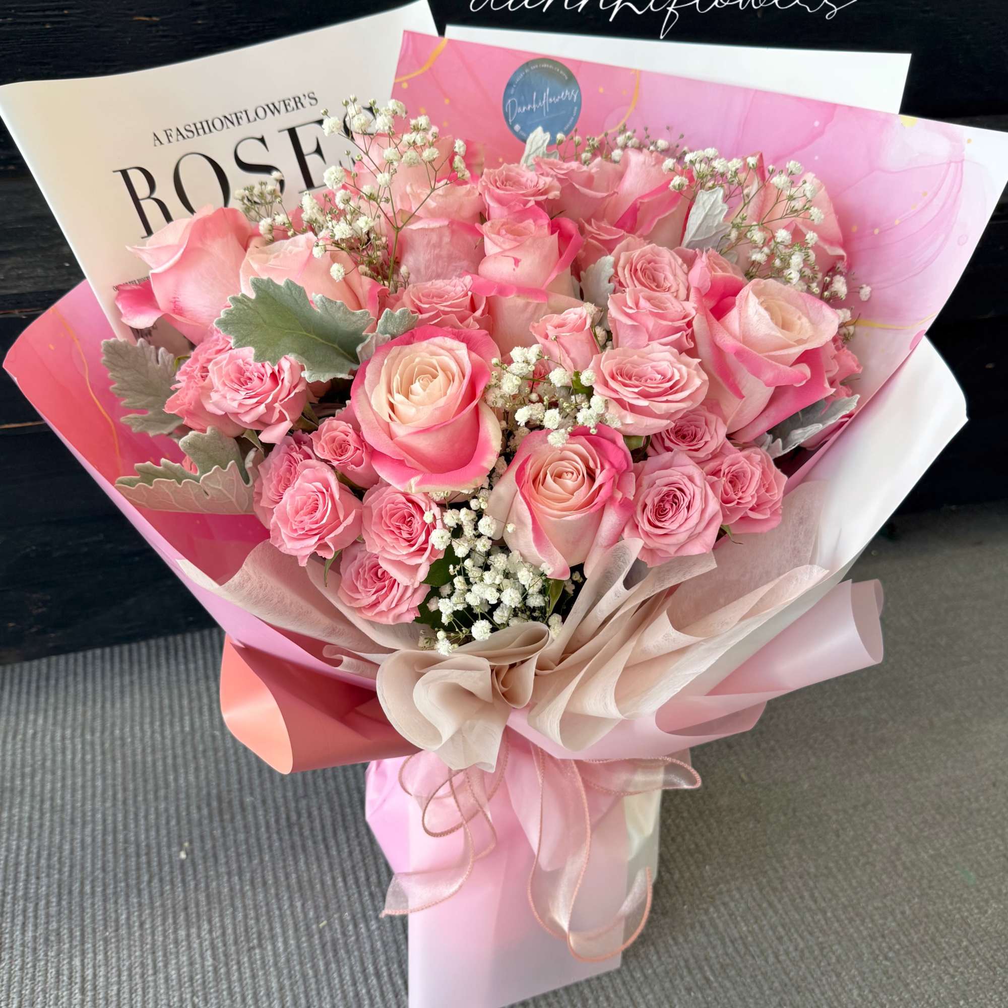 graceful blend of dusty pink bi-color roses, thoughtfully arranged to capture softness