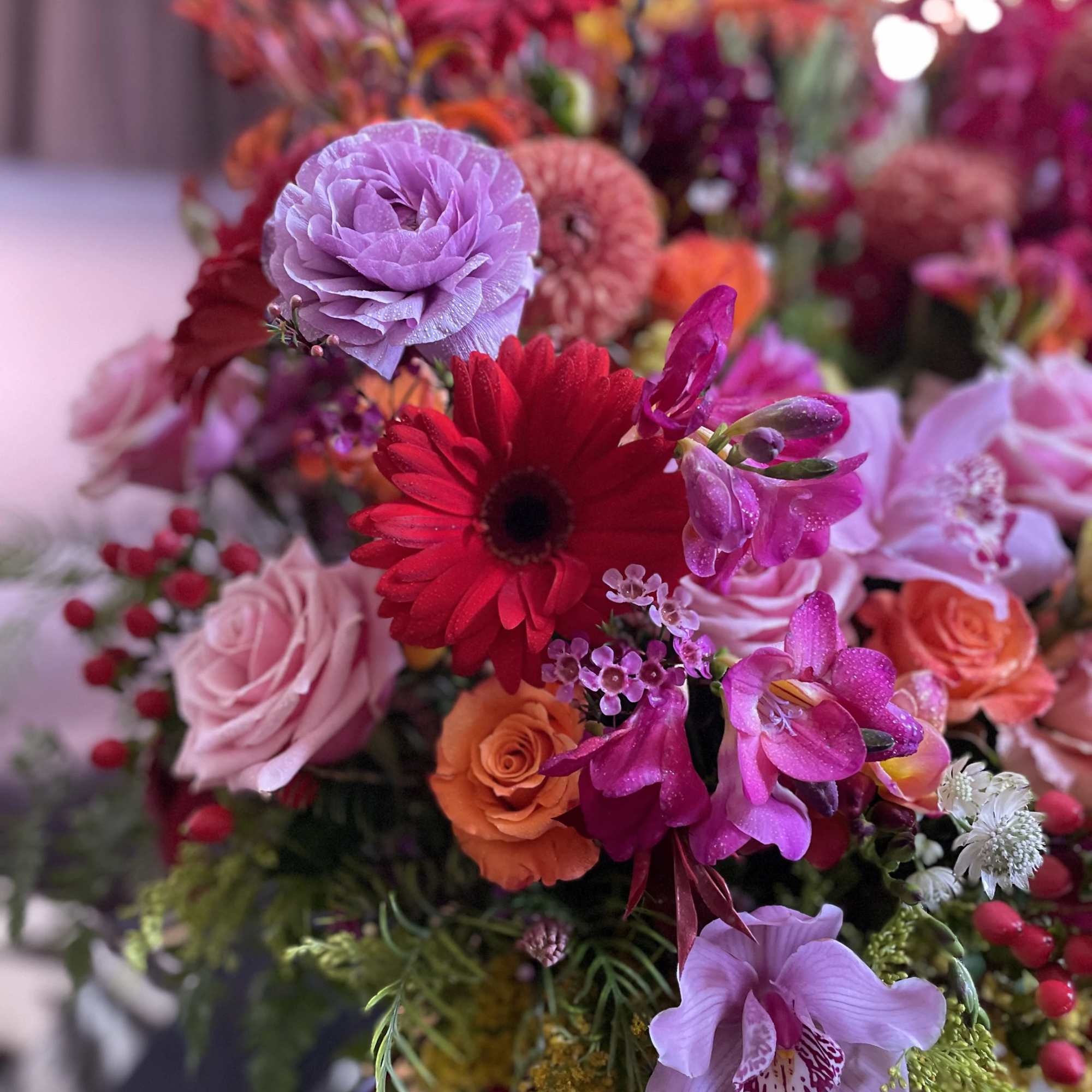 Mixed bouquet with pink, red, and purple flowers