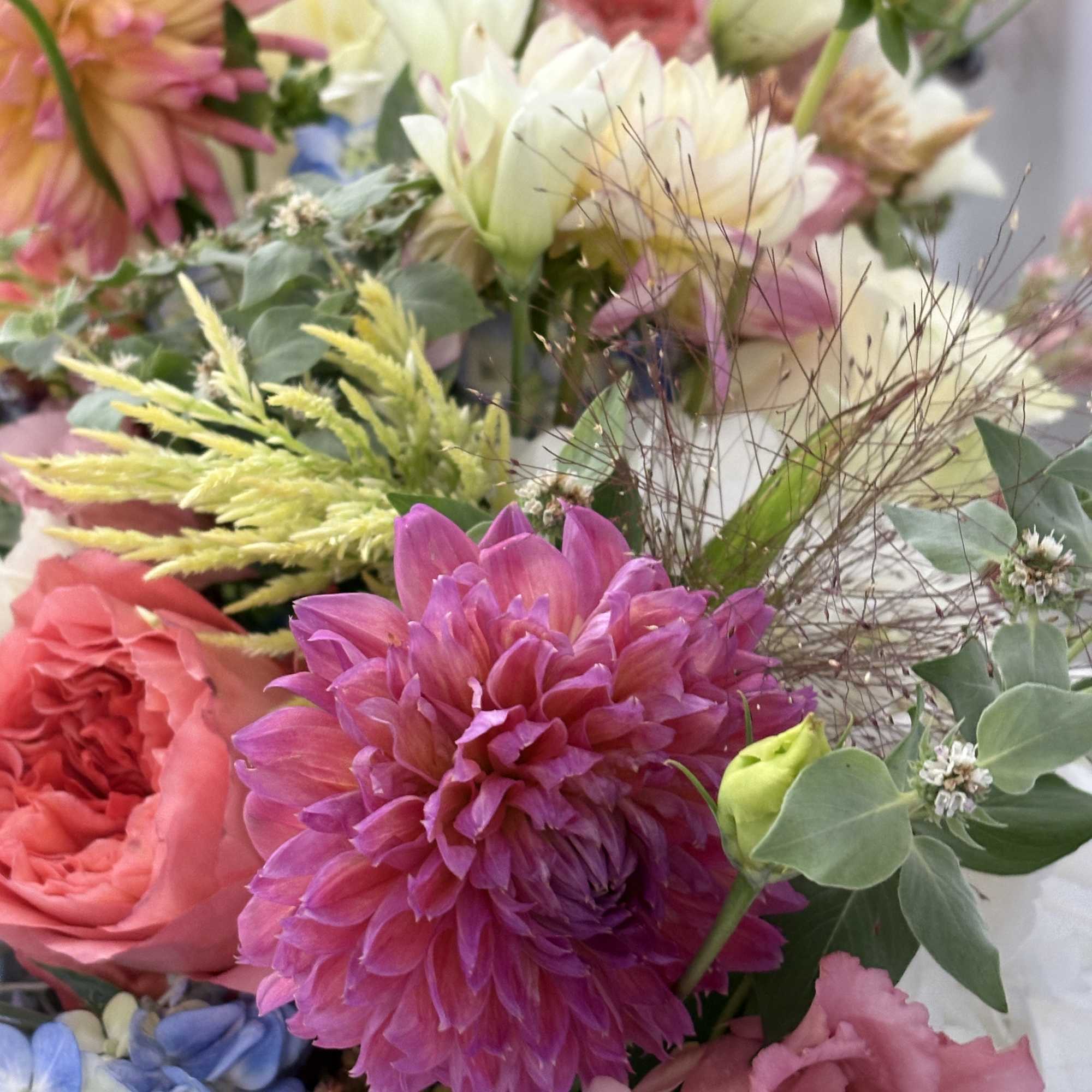 Mixed bouquet with pink, white, blue, and yellow flowers