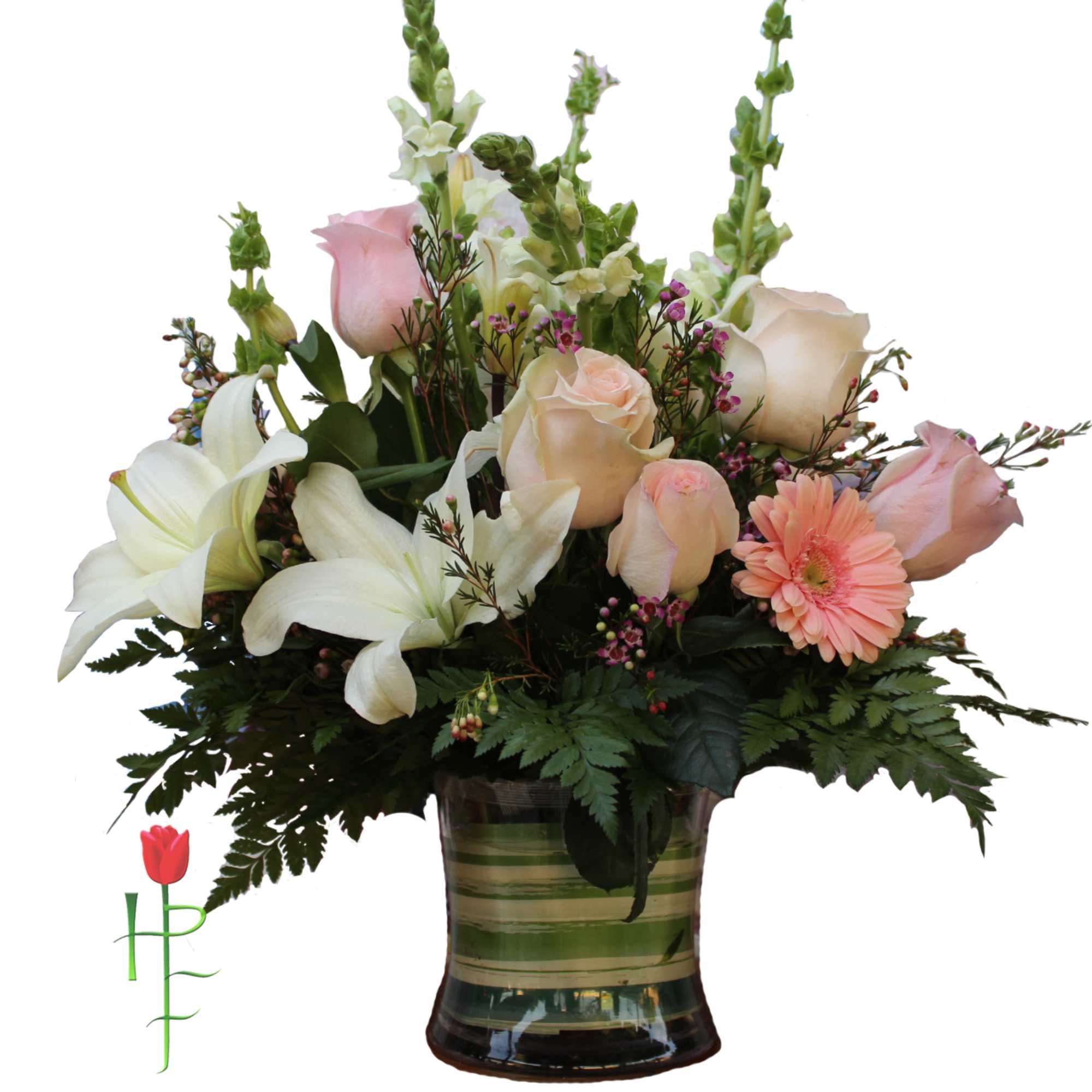 Mixed bouquet of roses, lilies, and gerbera daisies in a glass vase