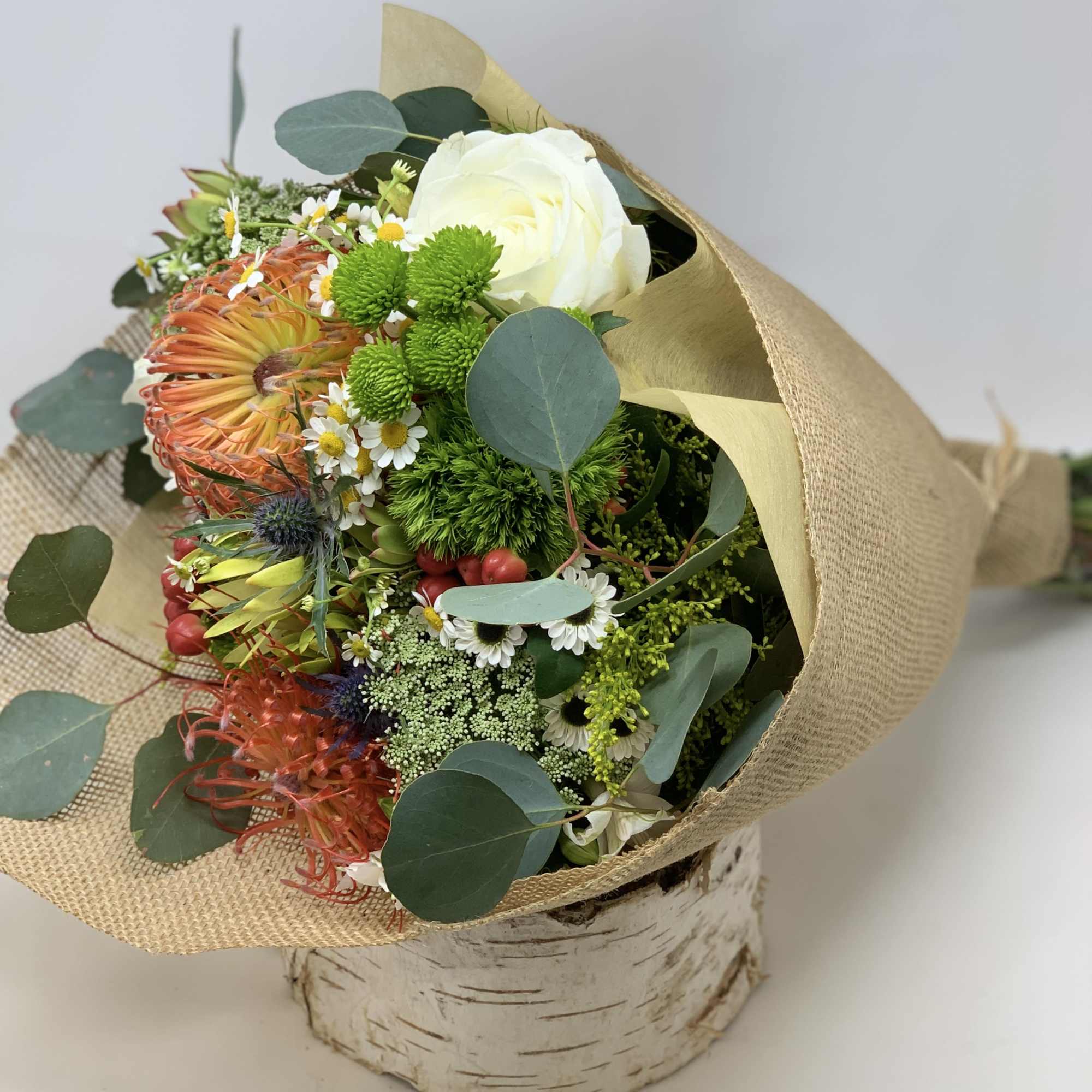 Seasonal flowers arranged into a rustic bouquet. , photo 3 of 3