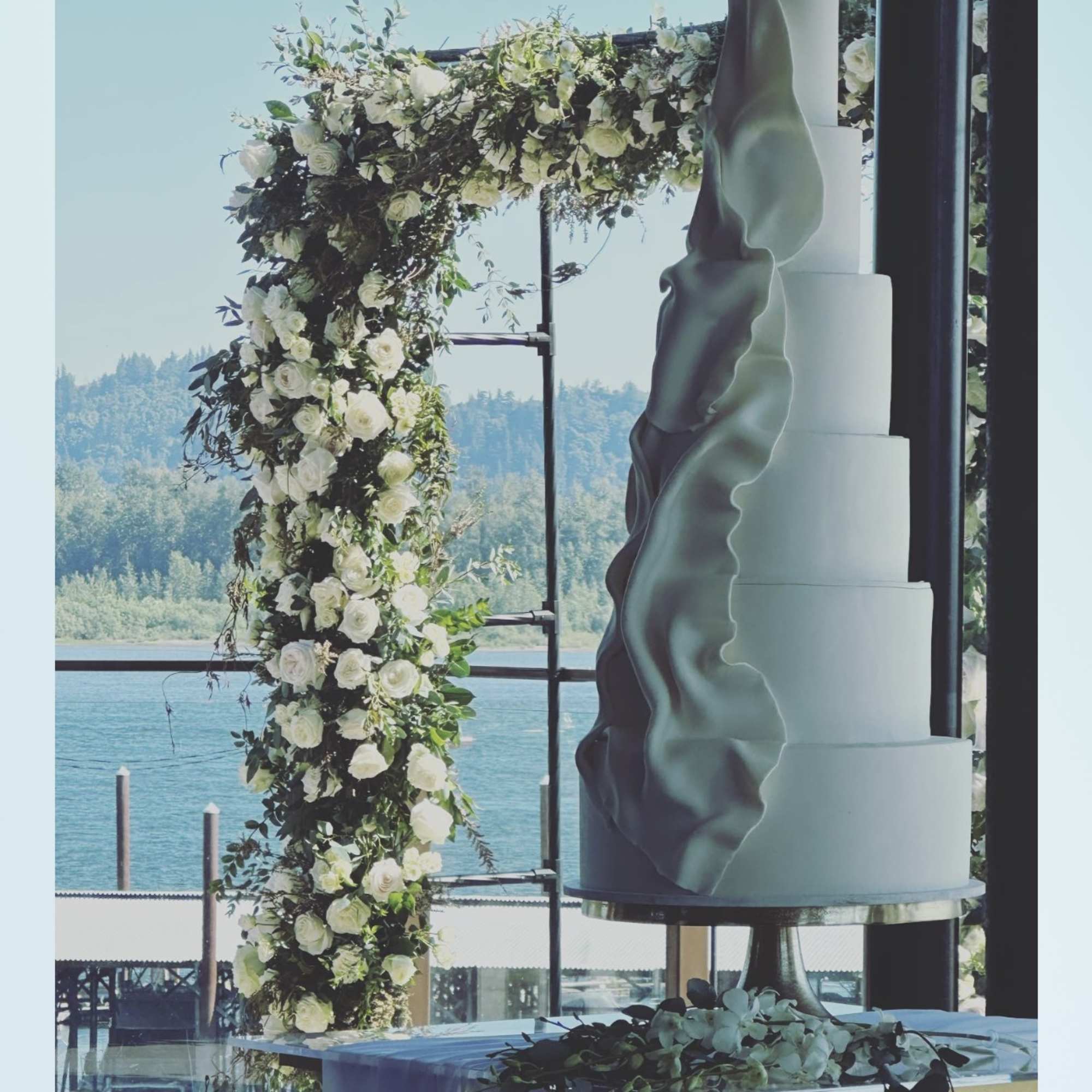 A breathtaking 10 by 8 ft ,floral arch with lush premium blooms