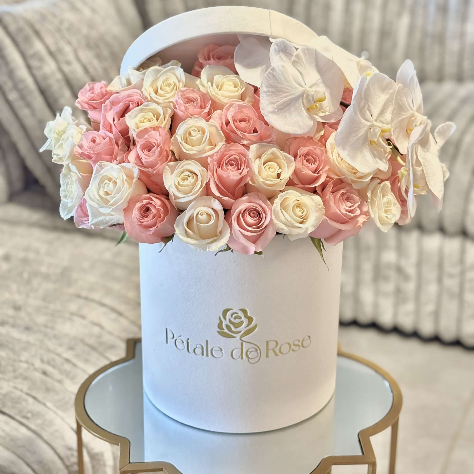 A timeless arrangement featuring 36 fresh pink and white roses complemented by