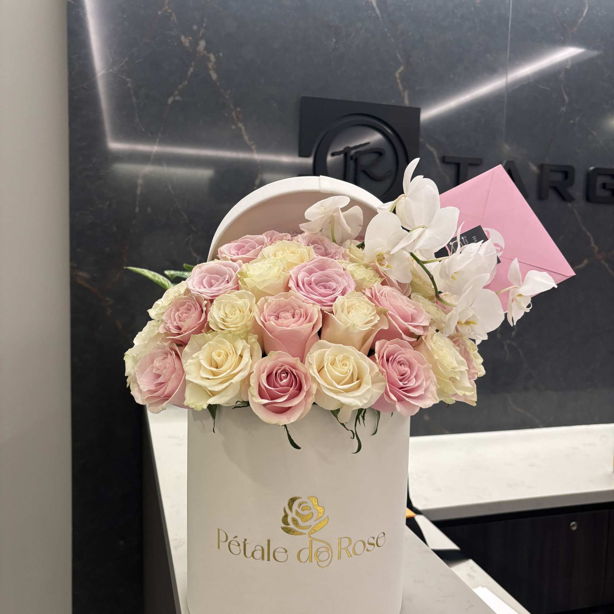 A timeless arrangement featuring 36 fresh pink and white roses complemented by, photo 2 of 3