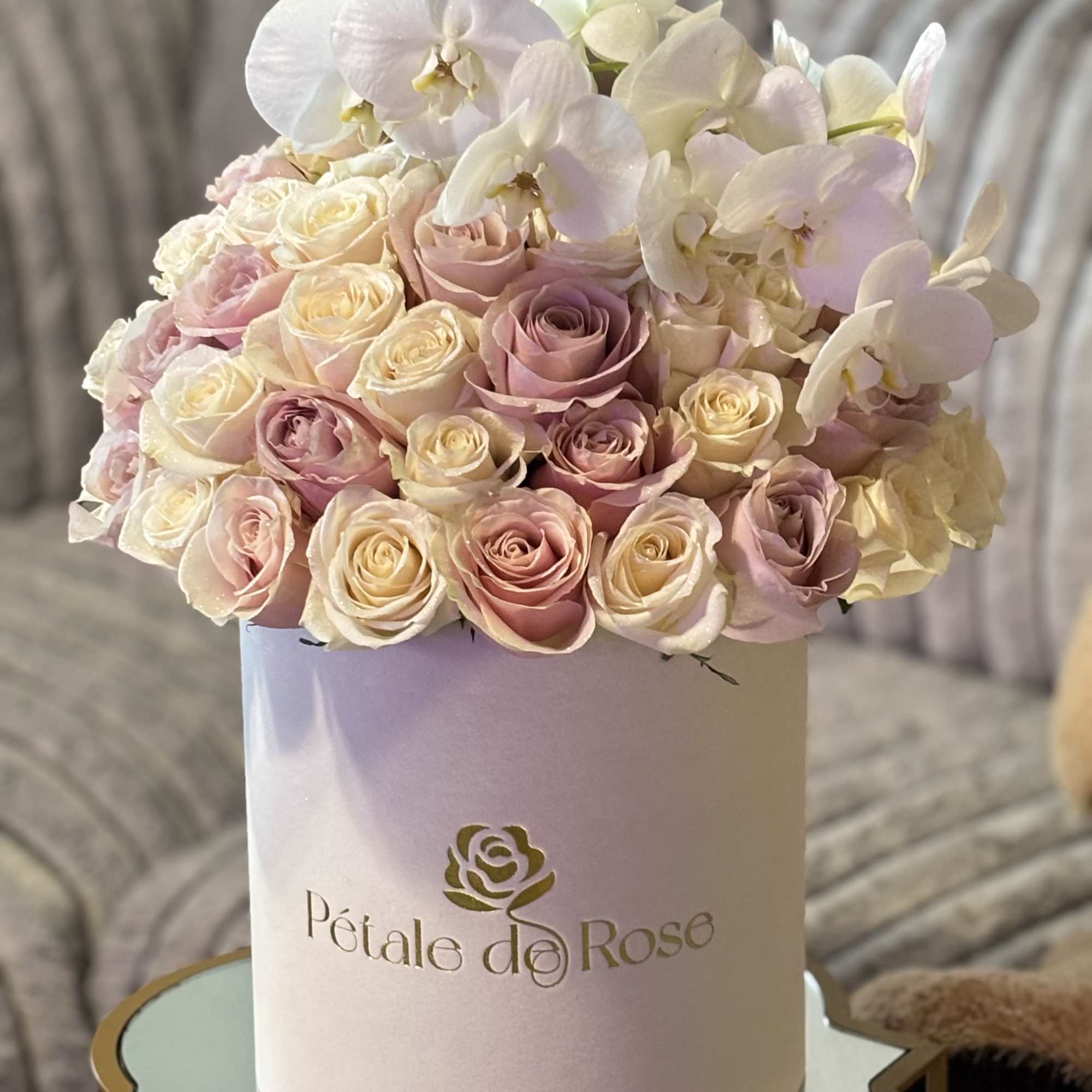 A timeless arrangement featuring 36 fresh pink and white roses complemented by