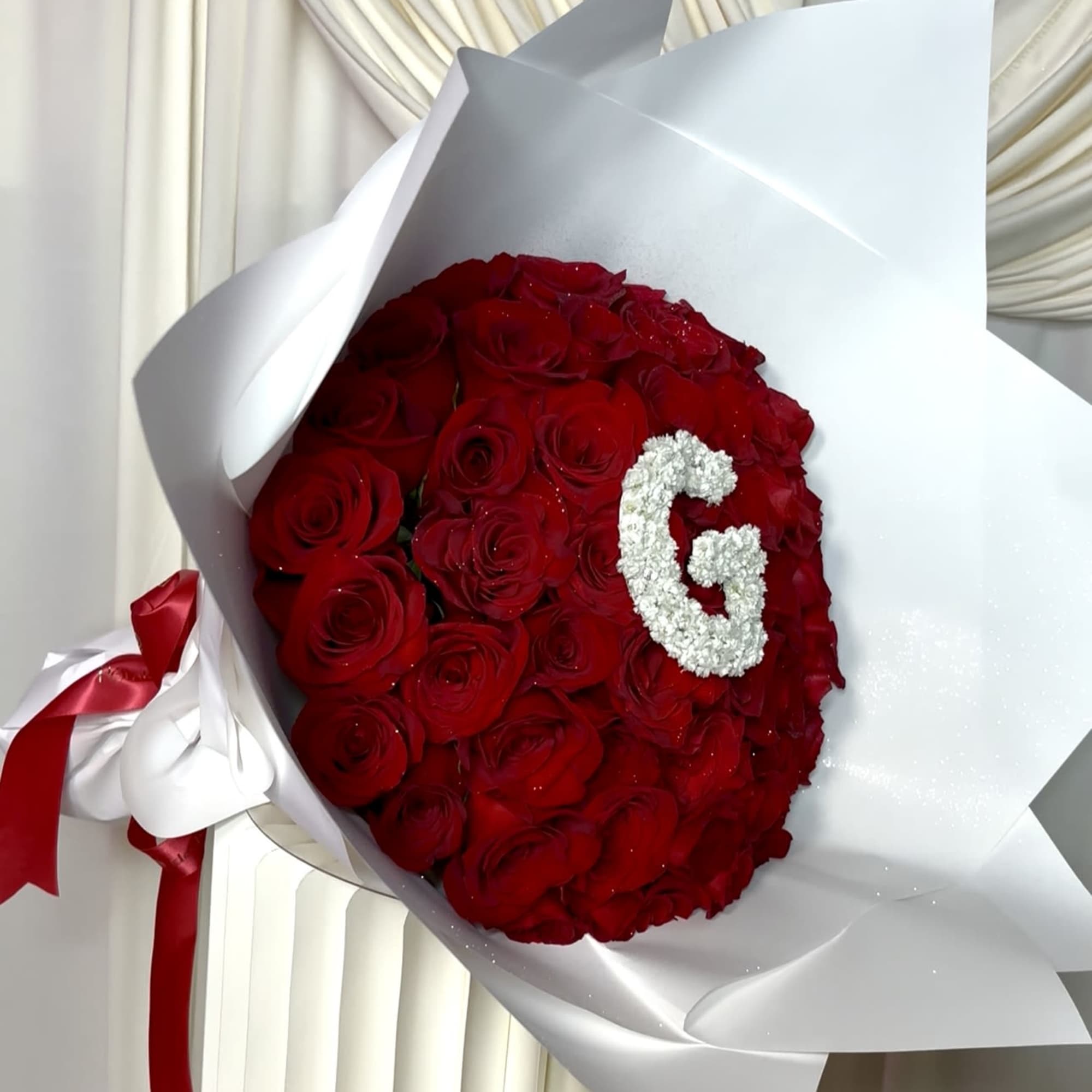 A luxurious statement bouquet featuring premium red roses beautifully wrapped in our, photo 3 of 4