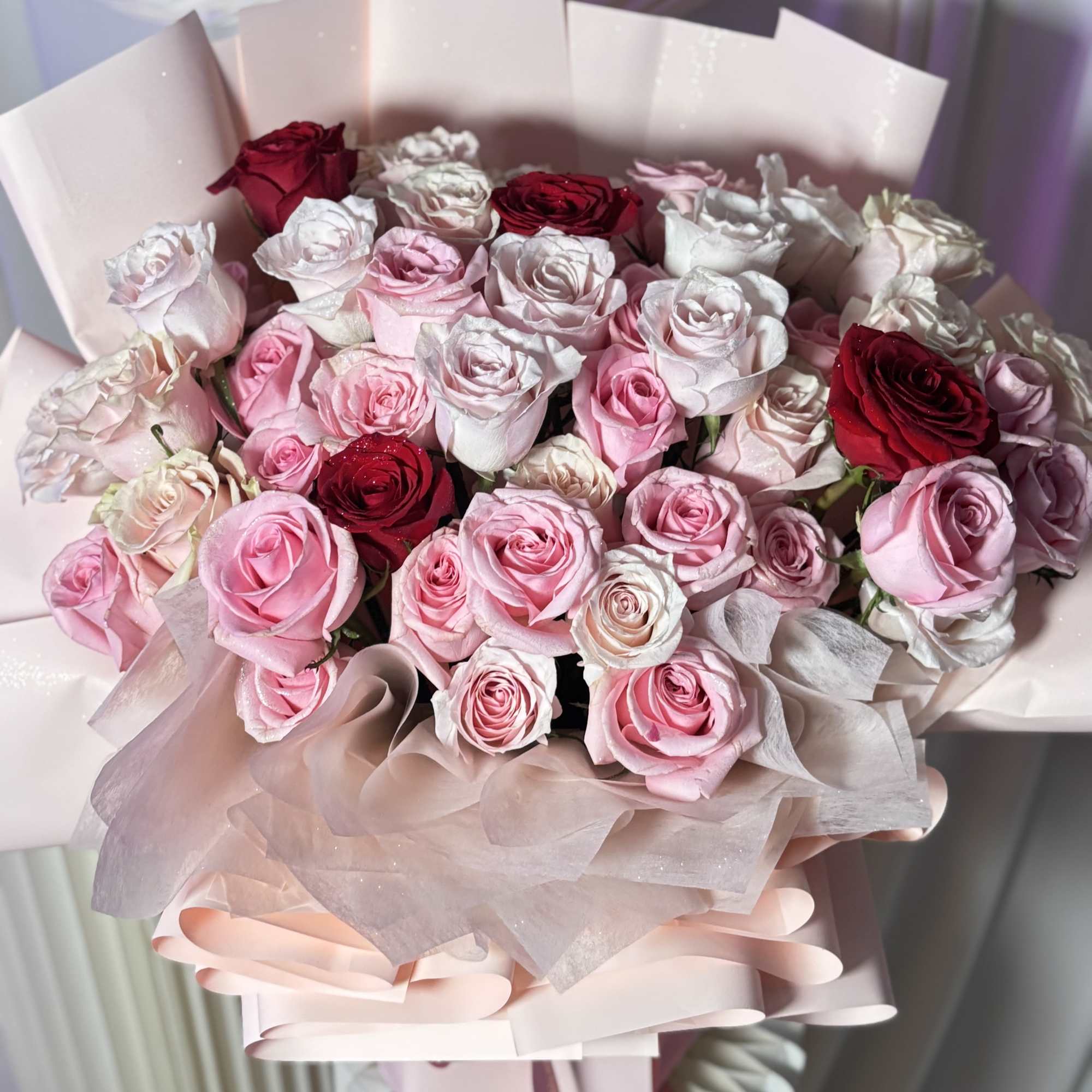 A romantic luxury bouquet featuring premium blush, ivory, and soft pink roses
