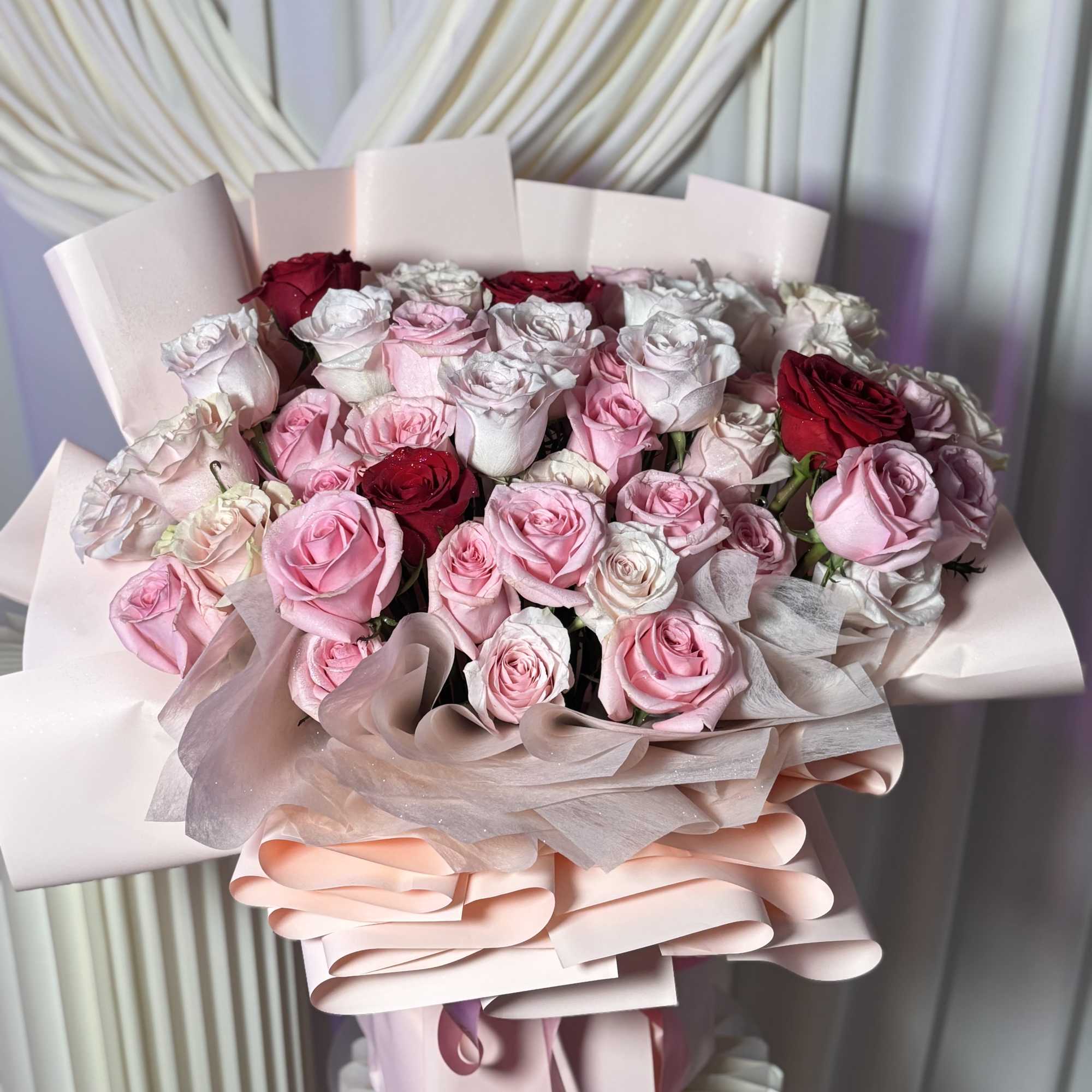 A romantic luxury bouquet featuring premium blush, ivory, and soft pink roses, photo 3 of 3