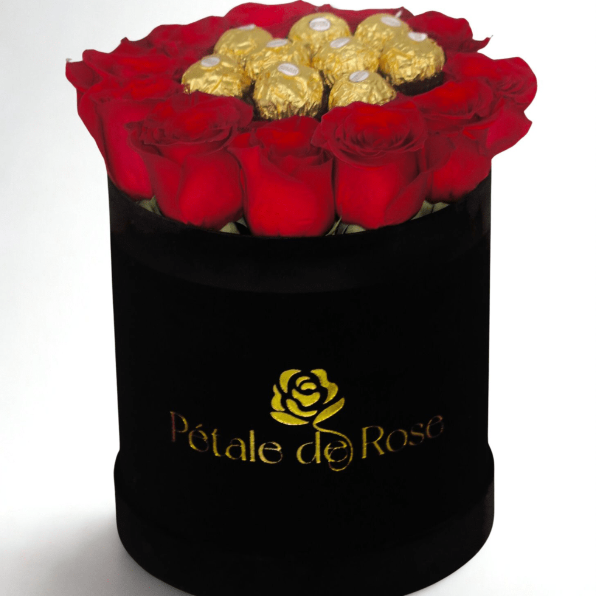 Round black hatbox with red roses surrounding gold-wrapped chocolates on top