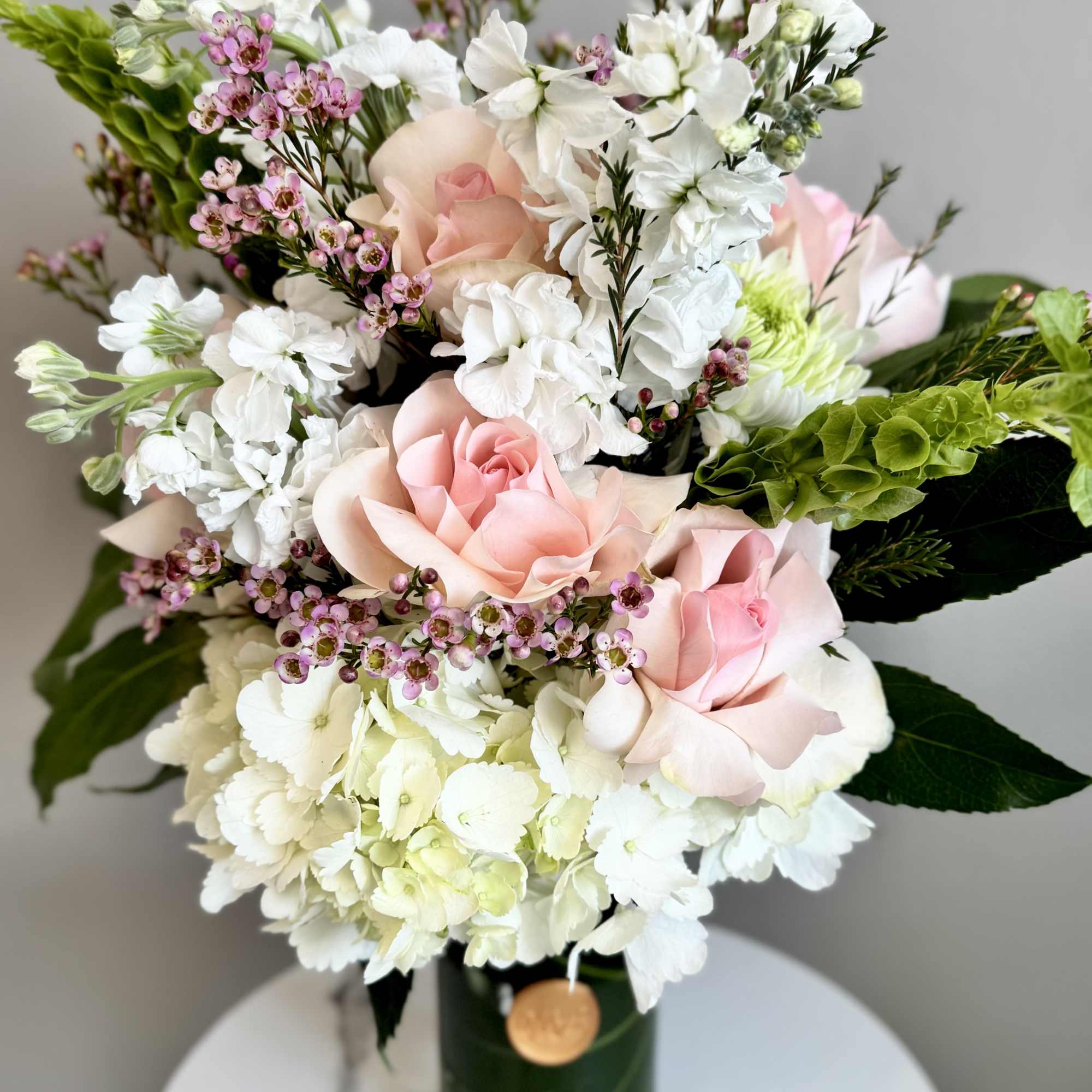 Pink and white bouquet in a glass vase