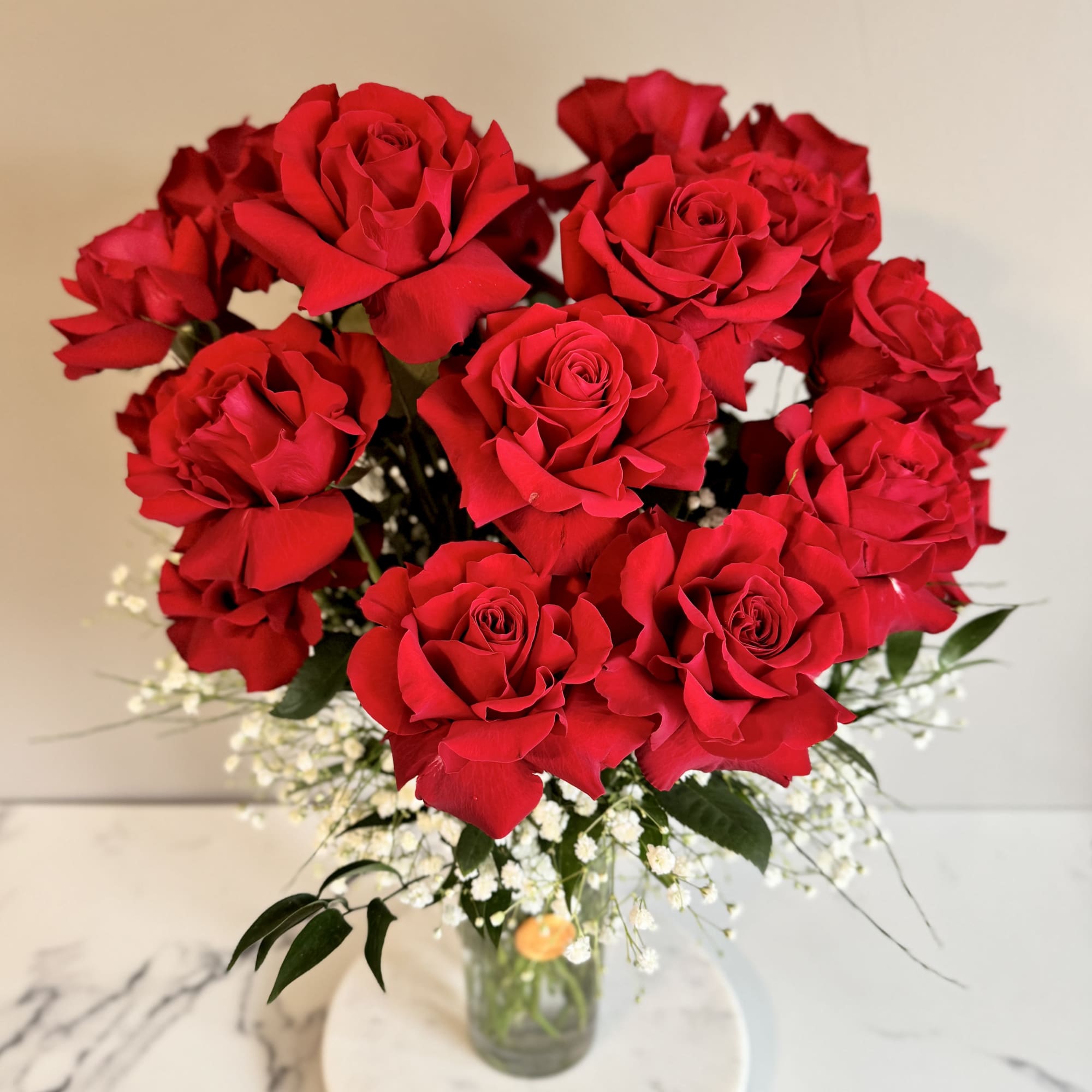 Bouquet of red roses in a clear glass vase