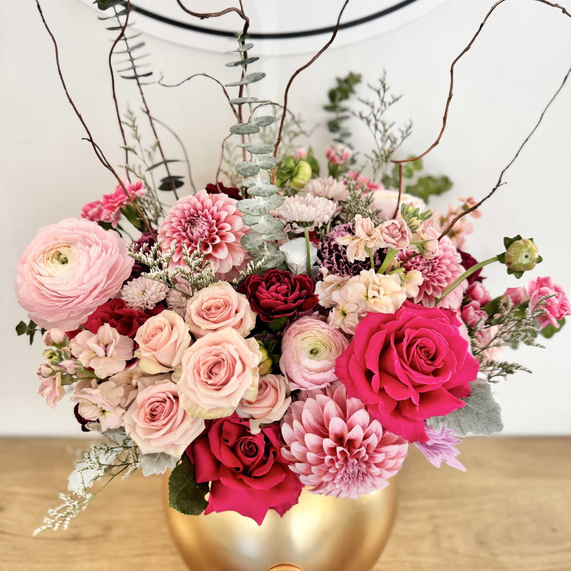 Make a statement with Golden Bloom Grandeur, a lavish floral arrangement designed