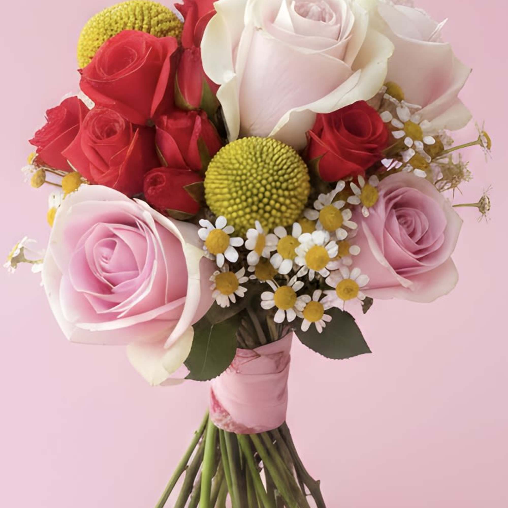 Soft pink and white roses layered with pops of bright red make