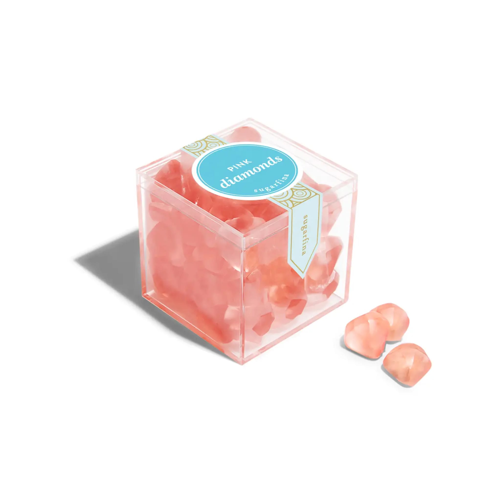 Clear cube box filled with pink candy pieces