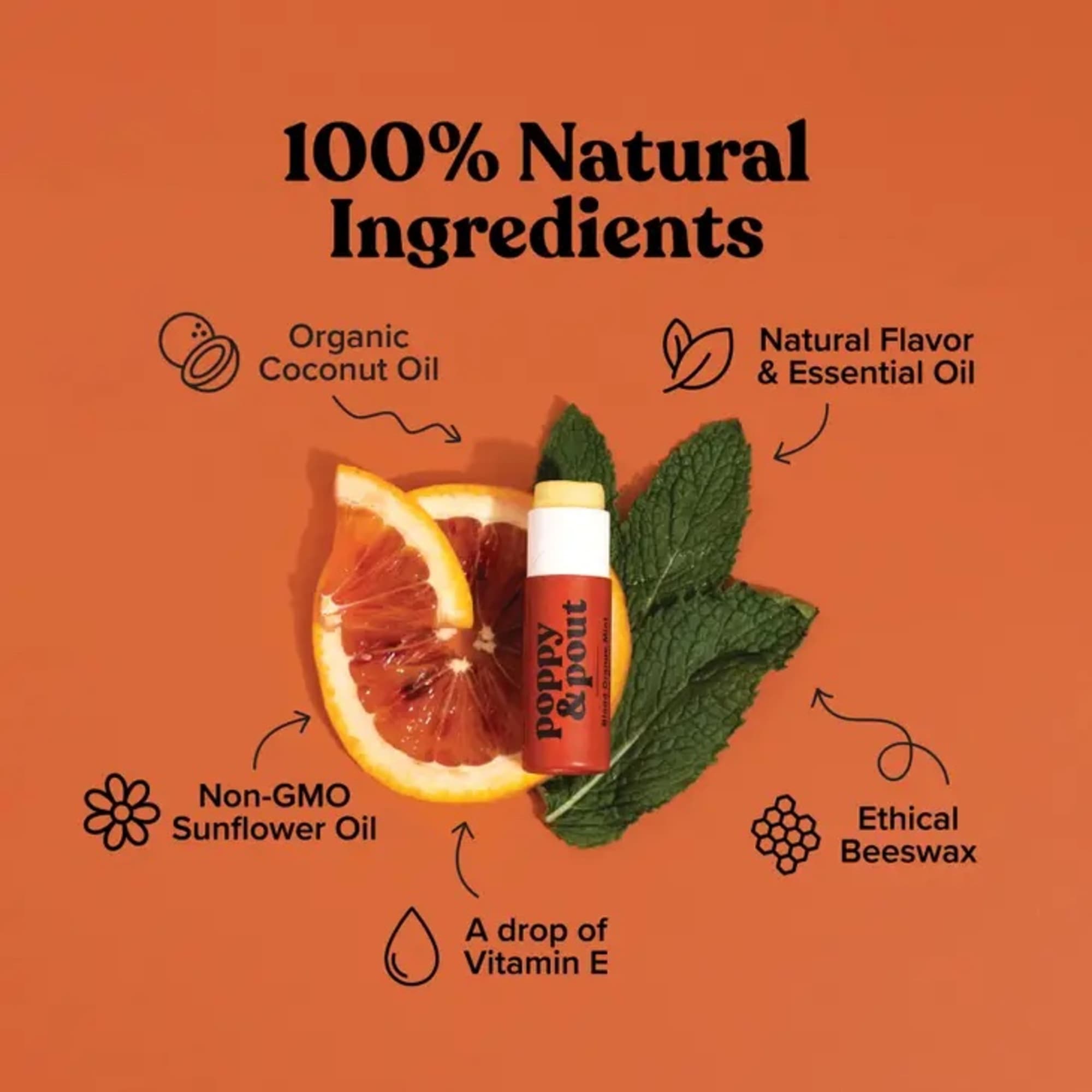 Lip balm tube with citrus slice and mint leaves on an orange background