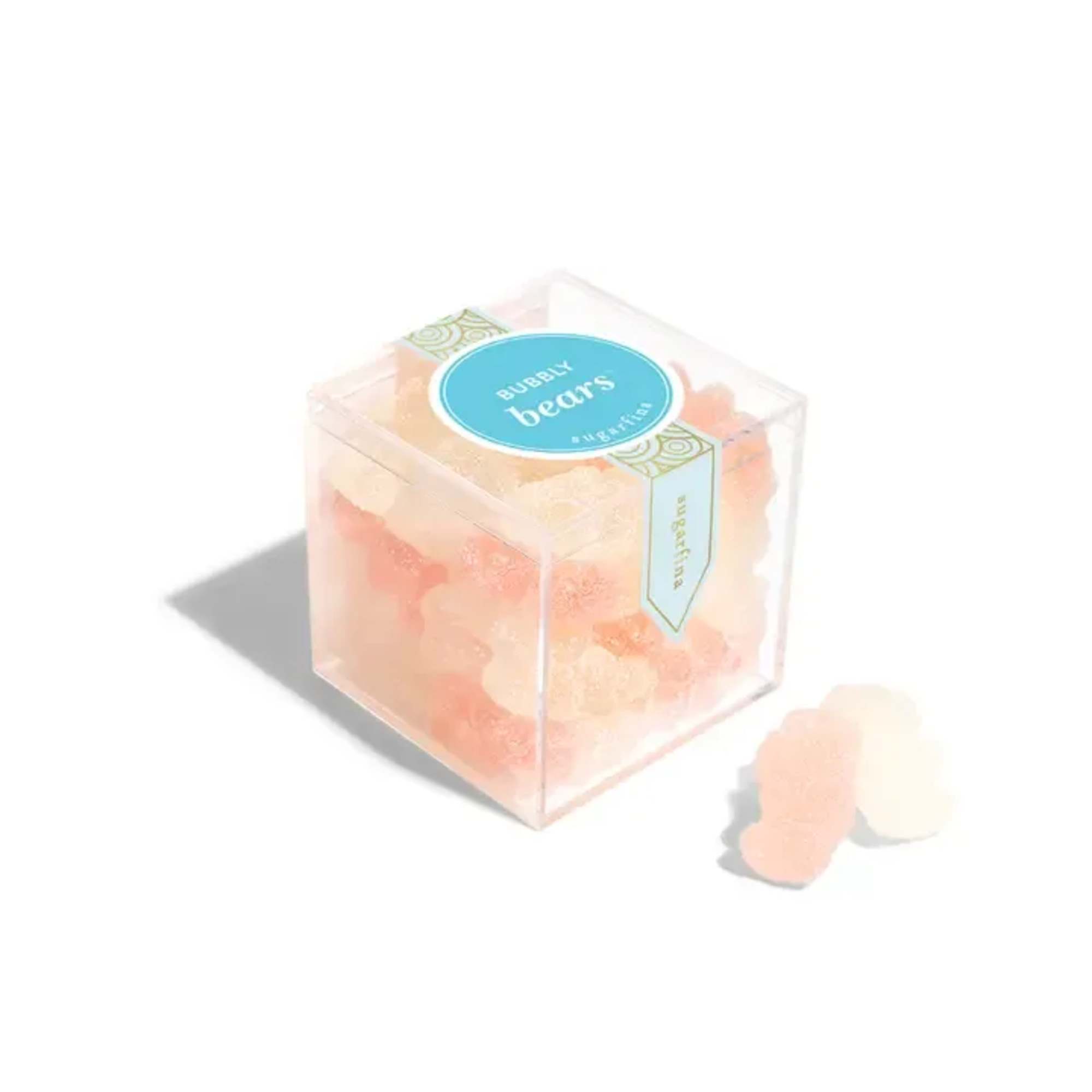 Clear box of peach and cream gummy bears with a blue label