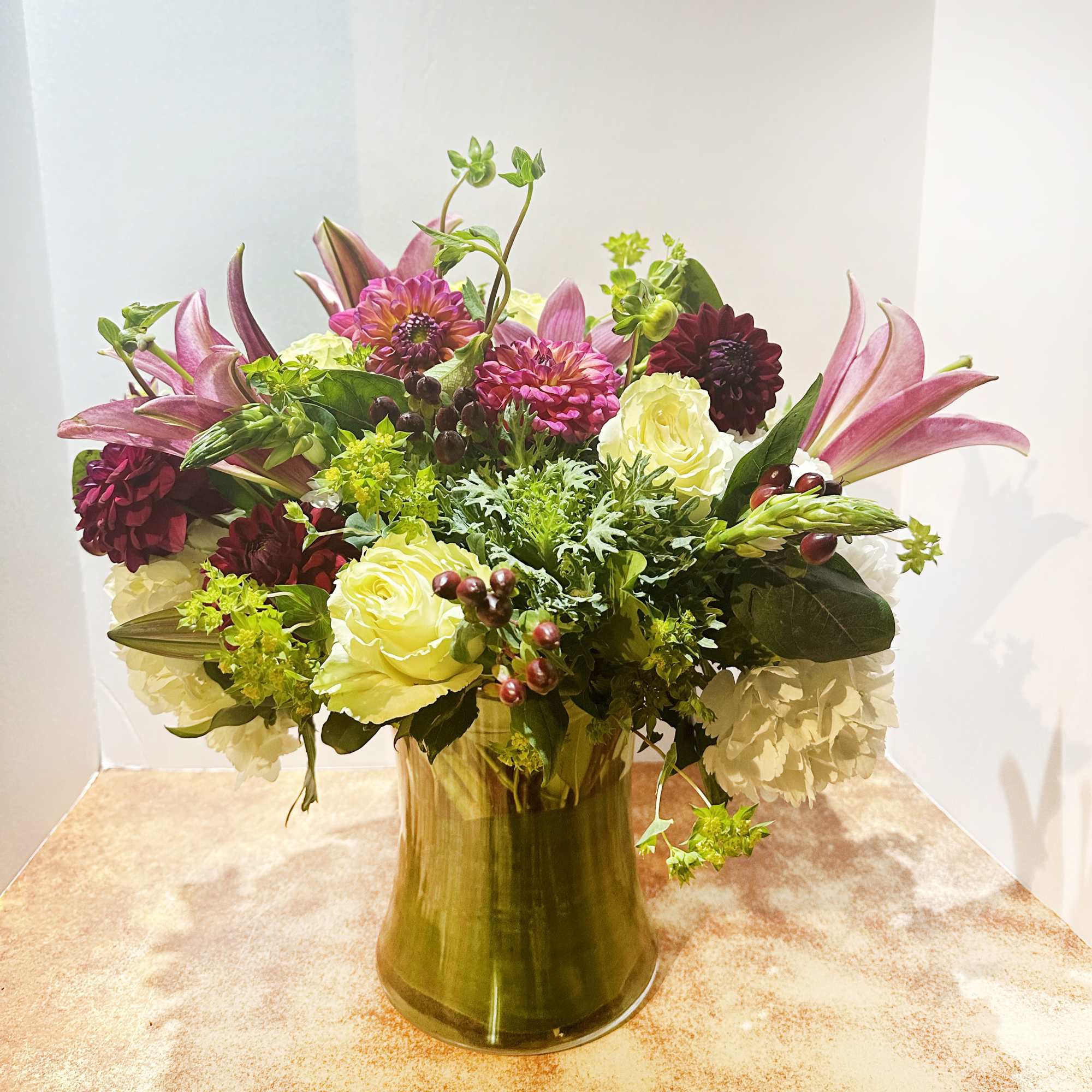 This arrangement is presented in a medium height clear glass vase. It, photo 2 of 2