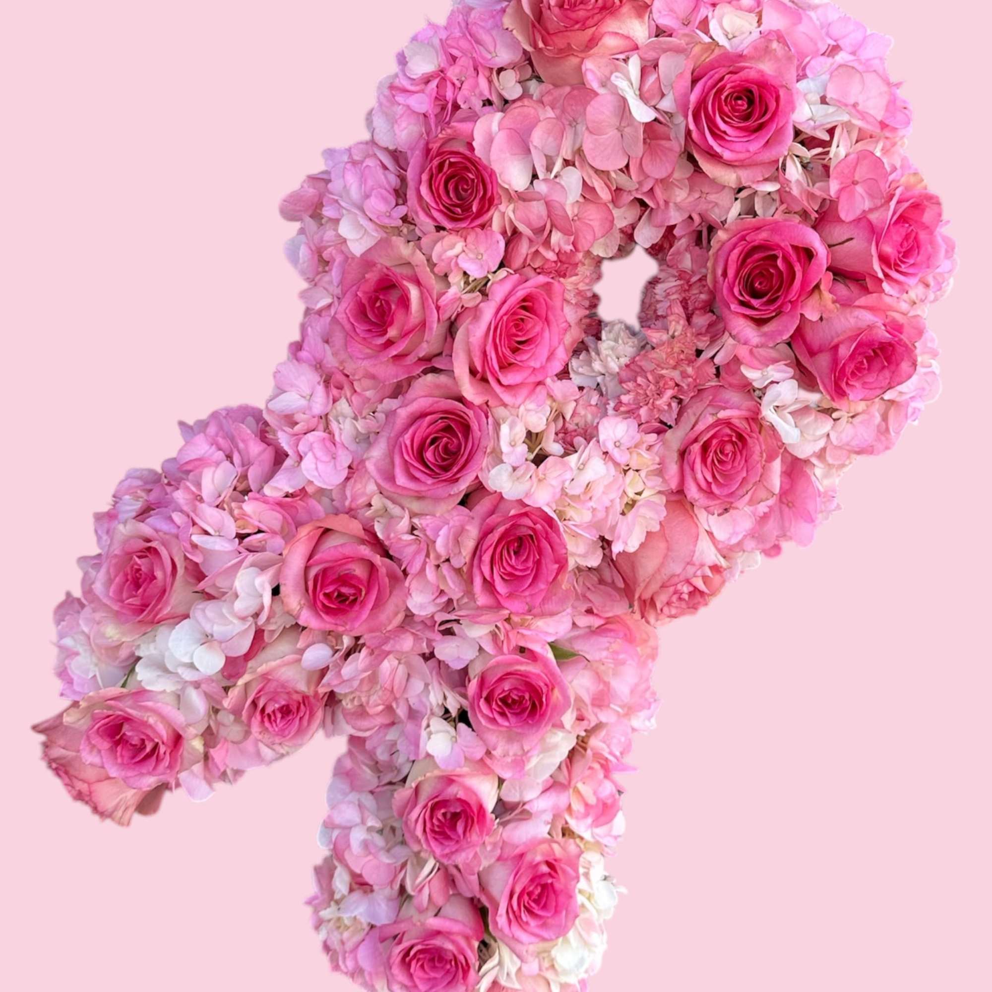 Pink rose and hydrangea floral arrangement shaped like a number 4