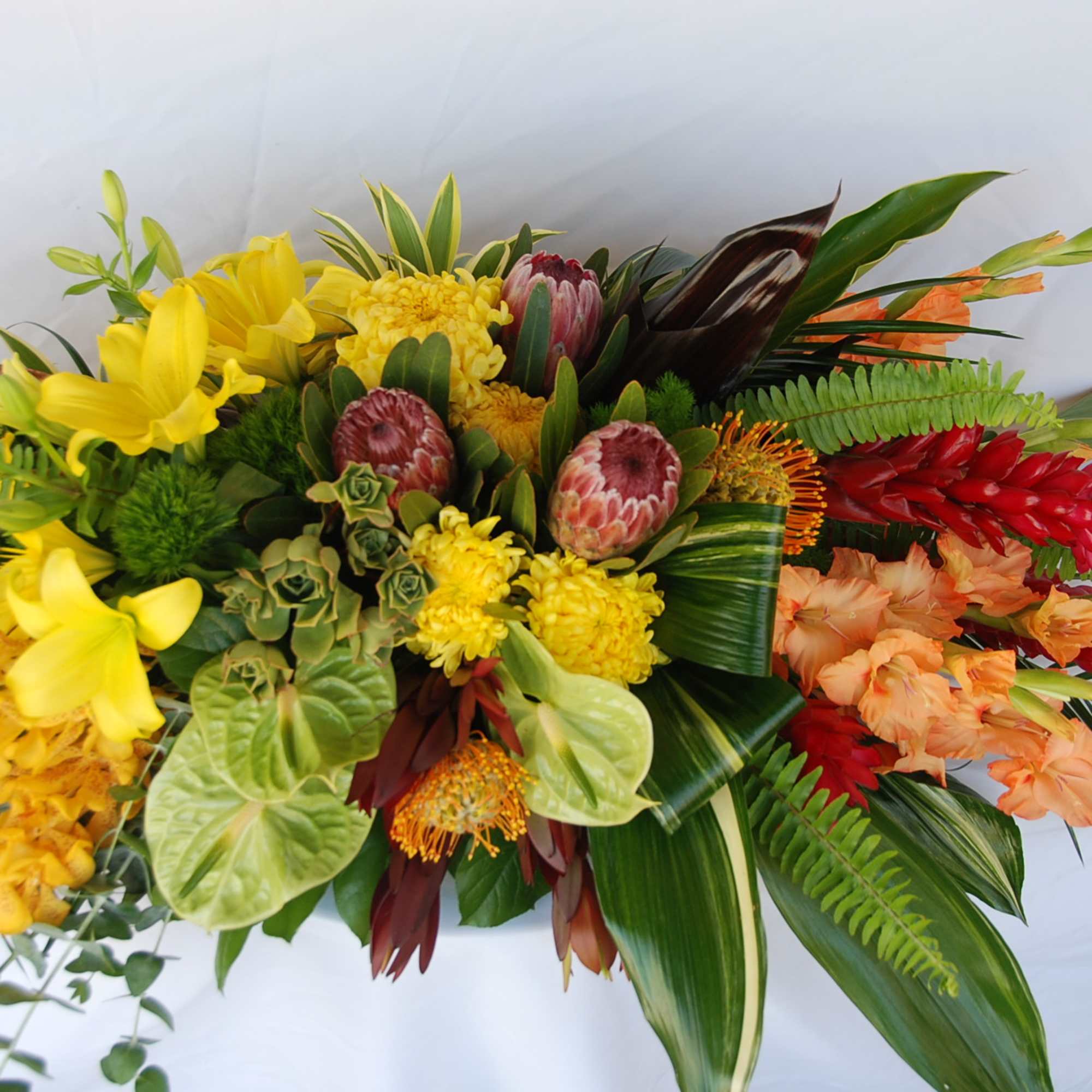 Mixed Tropical  Casket  Spray. 
