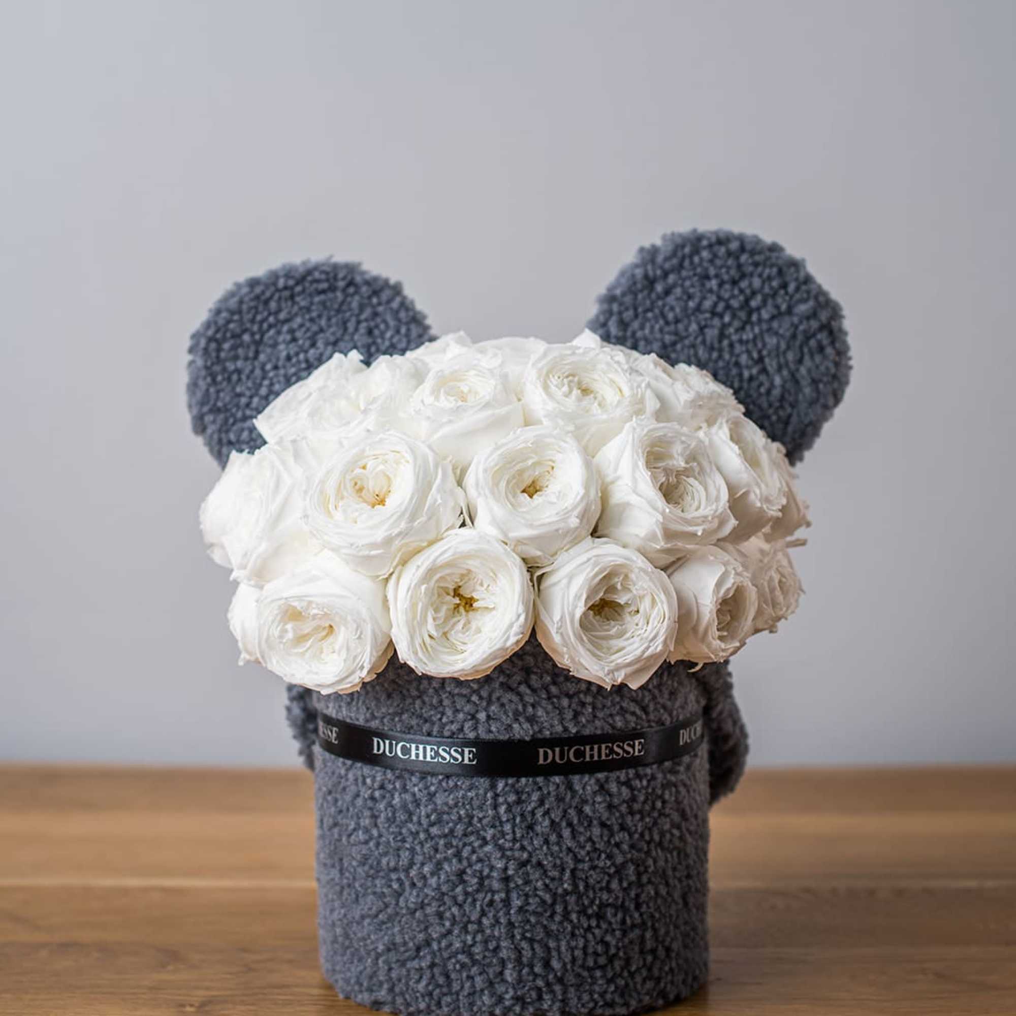 Bucket-style container with soft, fuzzy exterior
Cute pop-up animal ears
Round bouquet style
Choose from