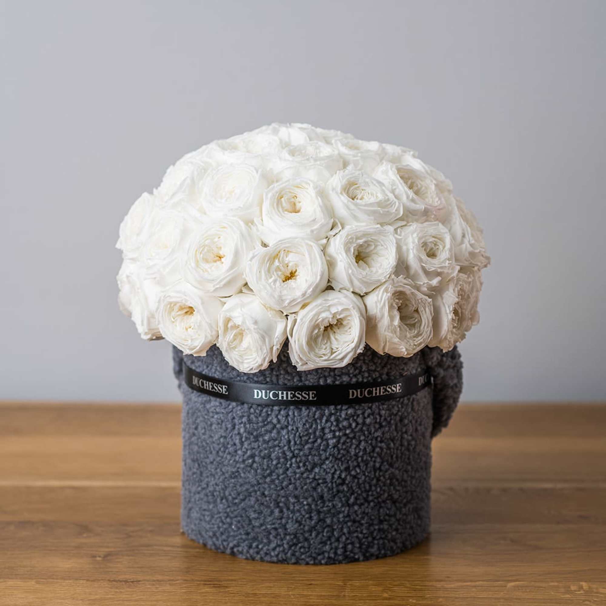 Bucket-style container with soft, fuzzy exterior
Cute pop-up animal ears
Round bouquet style
Choose from, photo 3 of 4