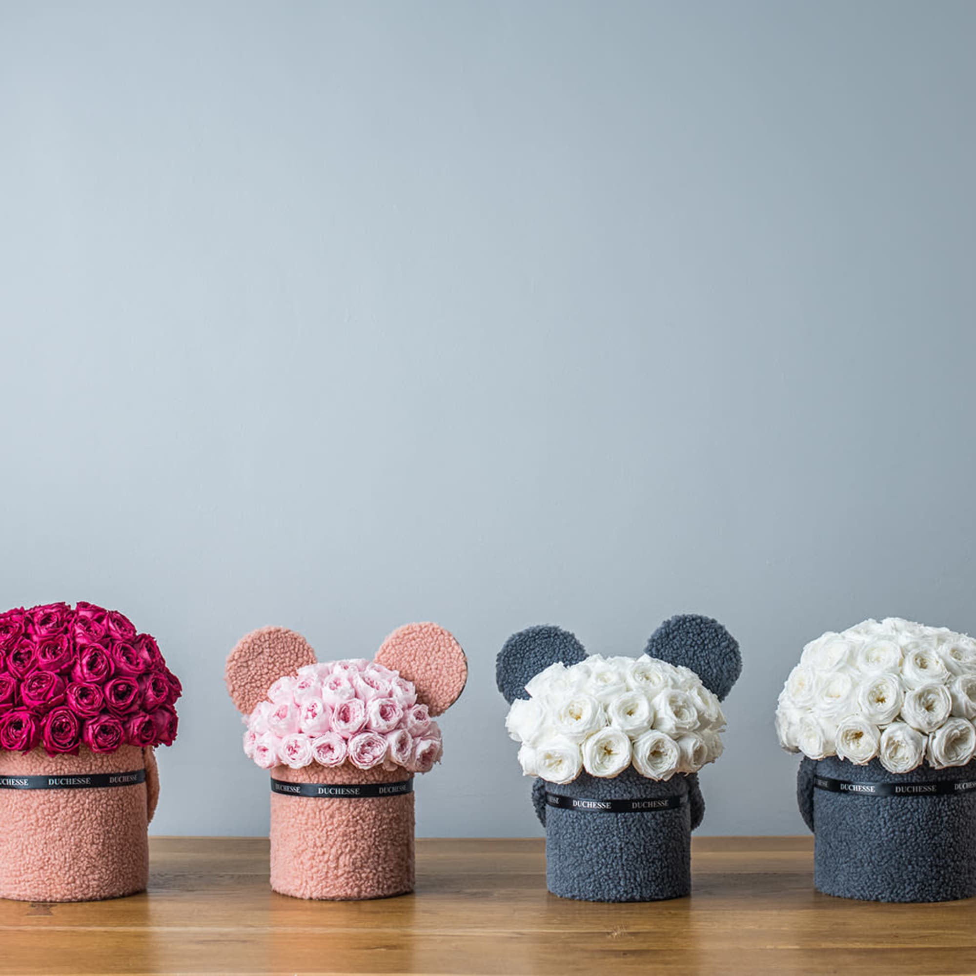 Bucket-style container with soft, fuzzy exterior
Cute pop-up animal ears
Round bouquet style
Choose from, photo 4 of 4