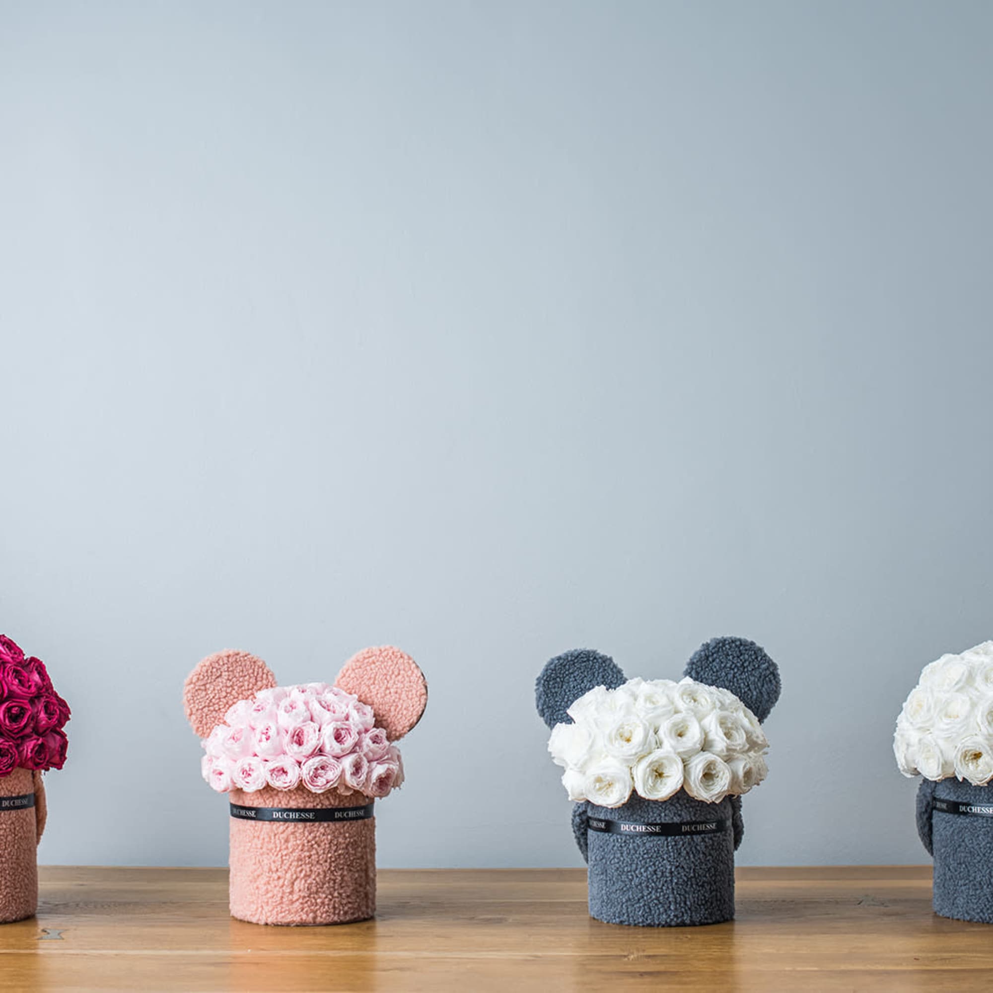 Bucket-style container with soft, fuzzy exterior
Cute pop-up animal ears
Round bouquet style
Choose from